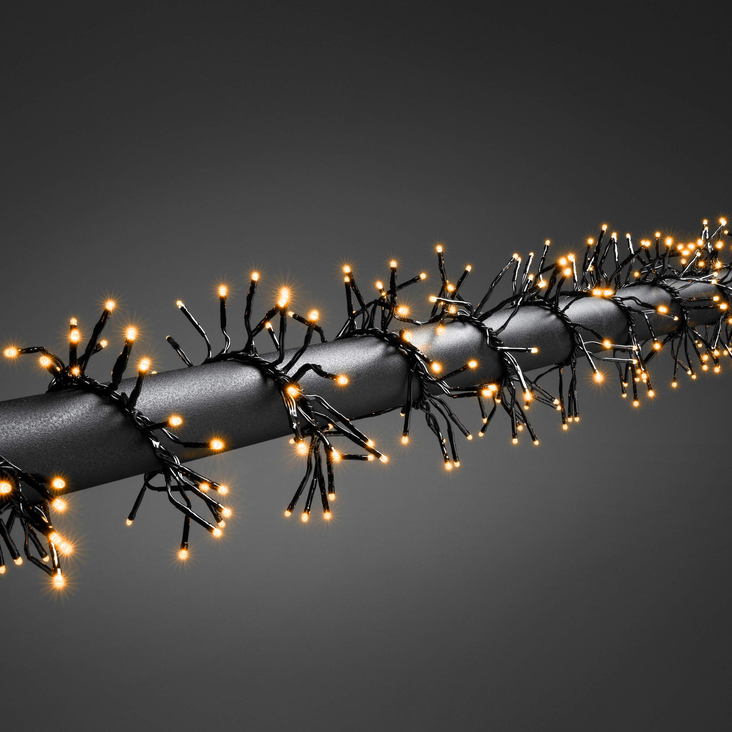 KONSTSMIDE LED-Lichterkette "Weihnachtsdeko aussen", Energieeffizienz: E (A-G), schwarz, Dioden 960 Stk. Flammen 960 Stk., Kabellänge 5m x Gesamtlänge 12,2m, Lichterketten, Micro LED Büschellichterkette Cluster, 960 bernsteinfarbene Dioden