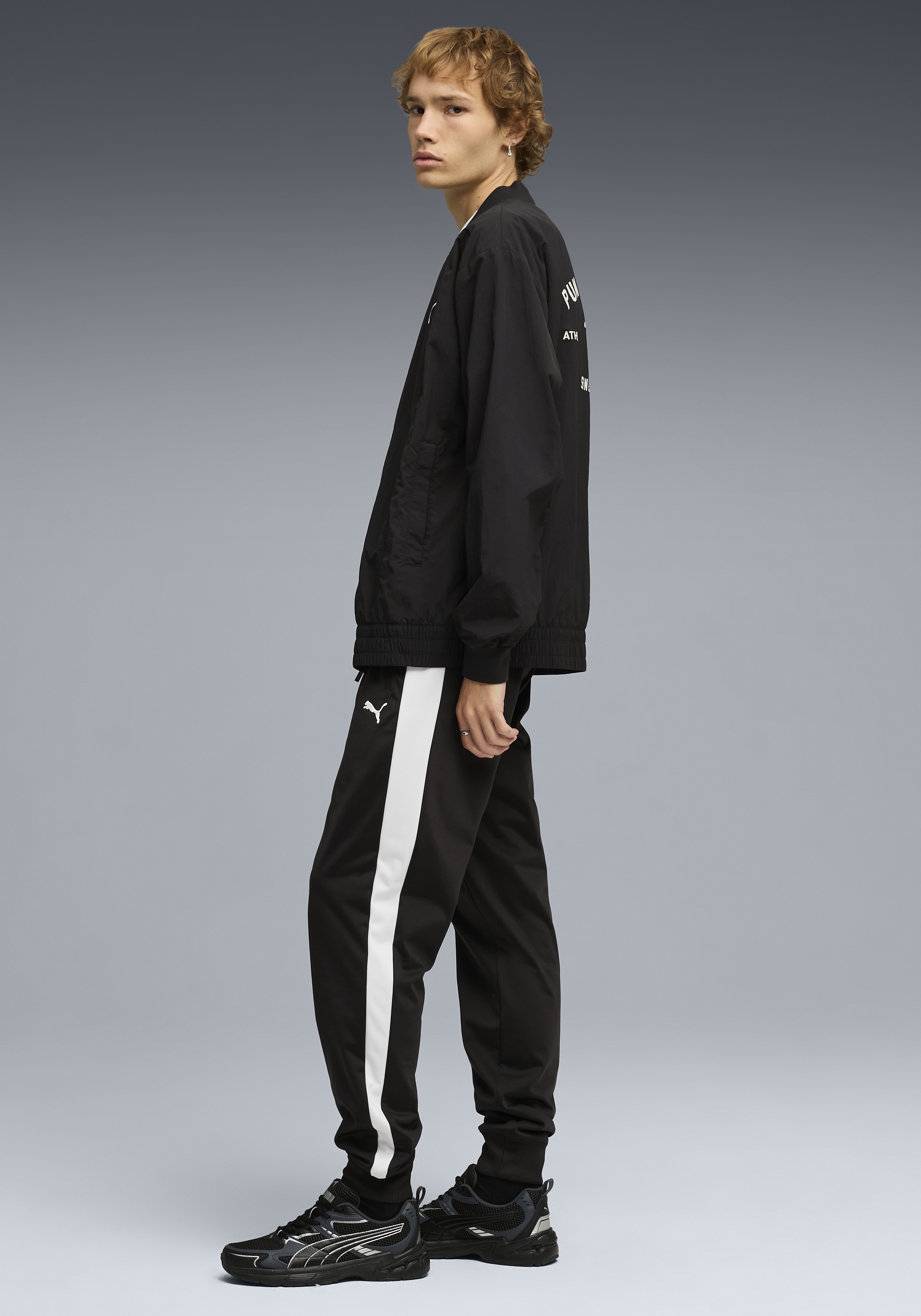 PUMA Trainingshose »T7 FOUNDATION CL POLY KNITTED PANTS«  mit Eingrifftaschen, Regular Fit, sportlicher Stil