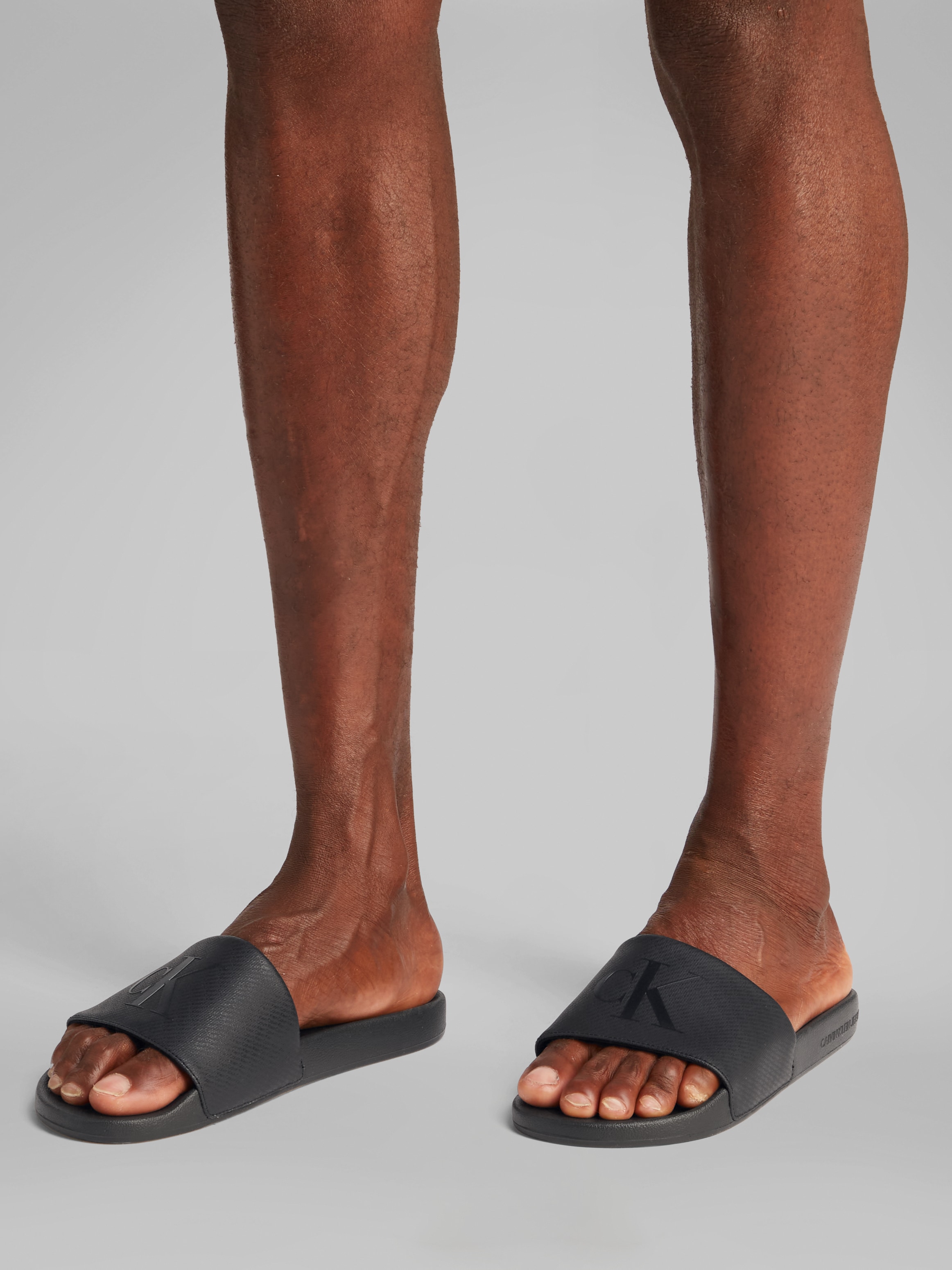 Calvin Klein Jeans Badepantolette »SLIDE AOP PRINT«, Schlappen, Poolslides, Sommerschuh, Strandschuh mit Logo