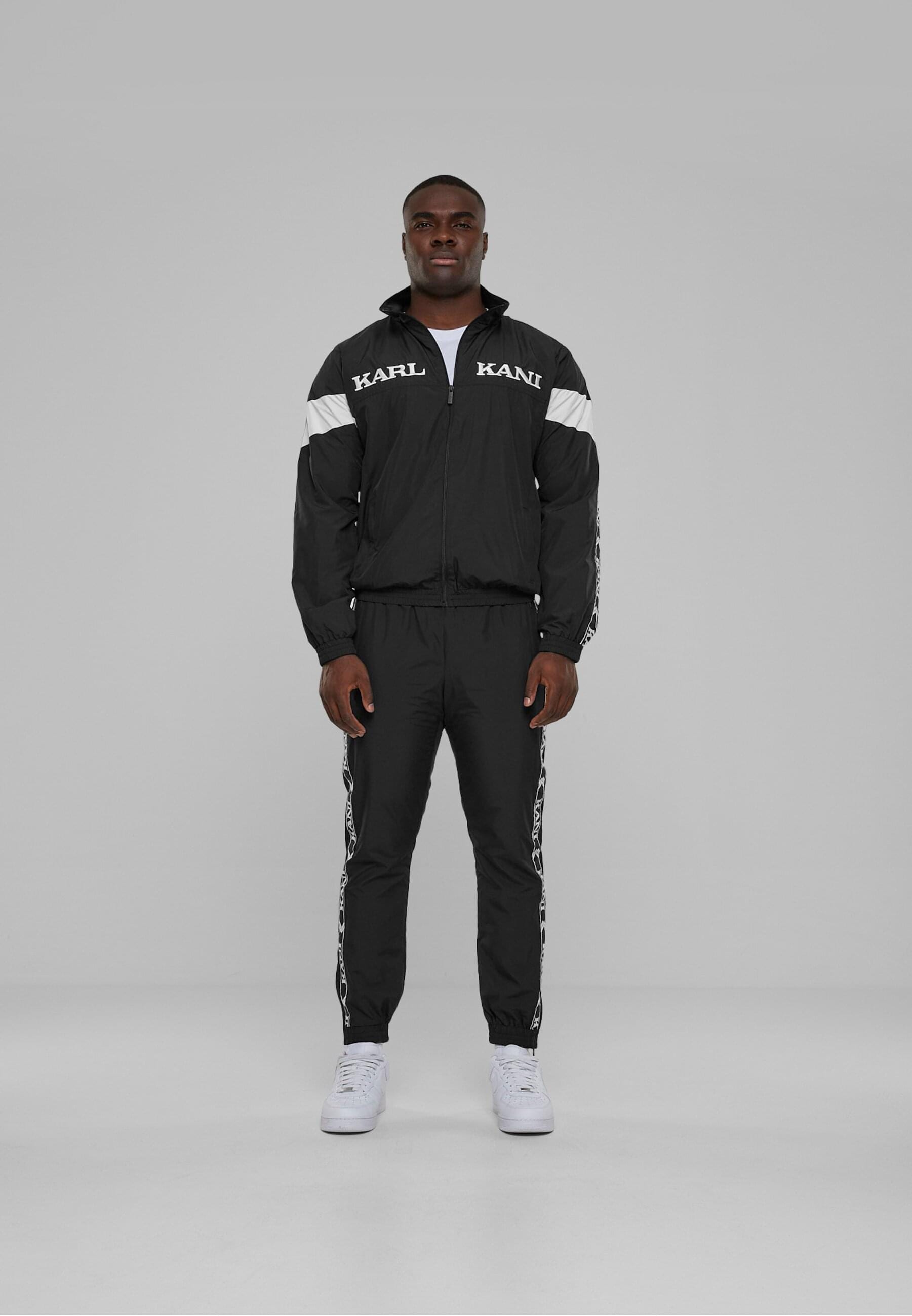 Karl Kani Allwetterjacke »Karl Kani Herren KKMQ32024BLK KK Retro Tape Trackjacket«, (1 St.), ohne Kapuze