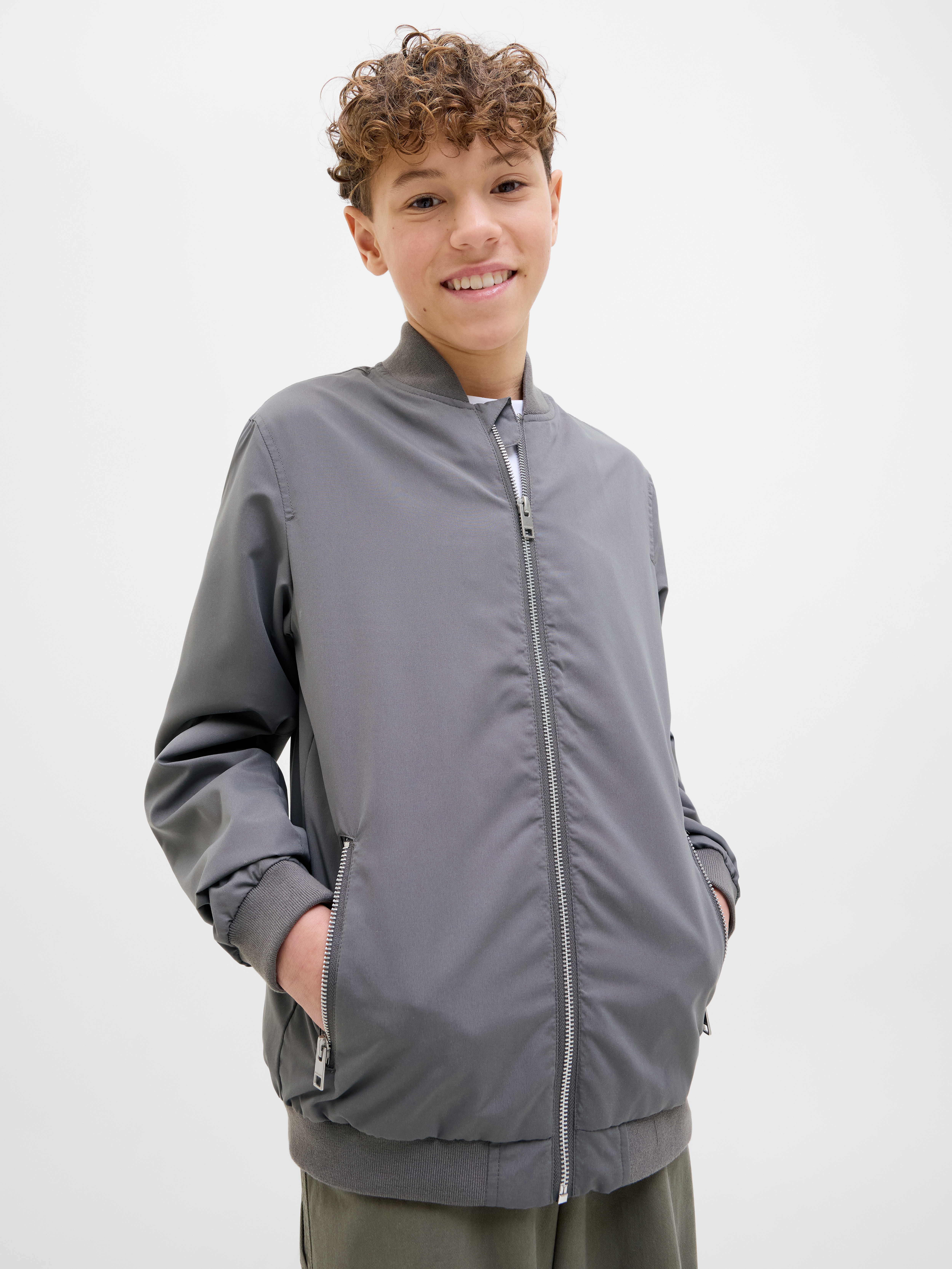 Jack & Jones Junior Bomberjacke "JJERUSH windabweisend und pflegeleicht" ohne Kapuze unifarben, modisch, regular fit, Web, Stehkragen
