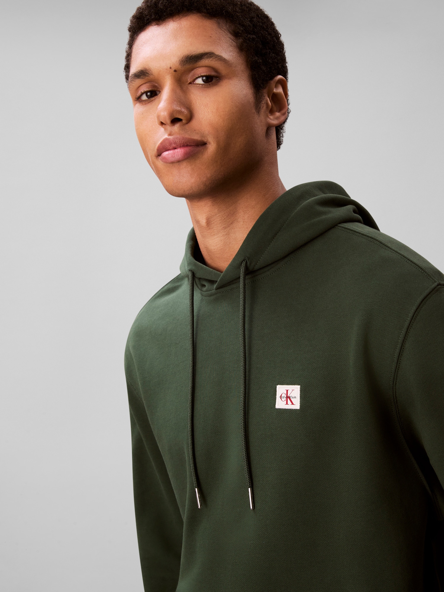Calvin Klein Jeans Kapuzensweatshirt »400GSM TERRY BADGE HOODIE«, Mit Rundhalsausschnitt