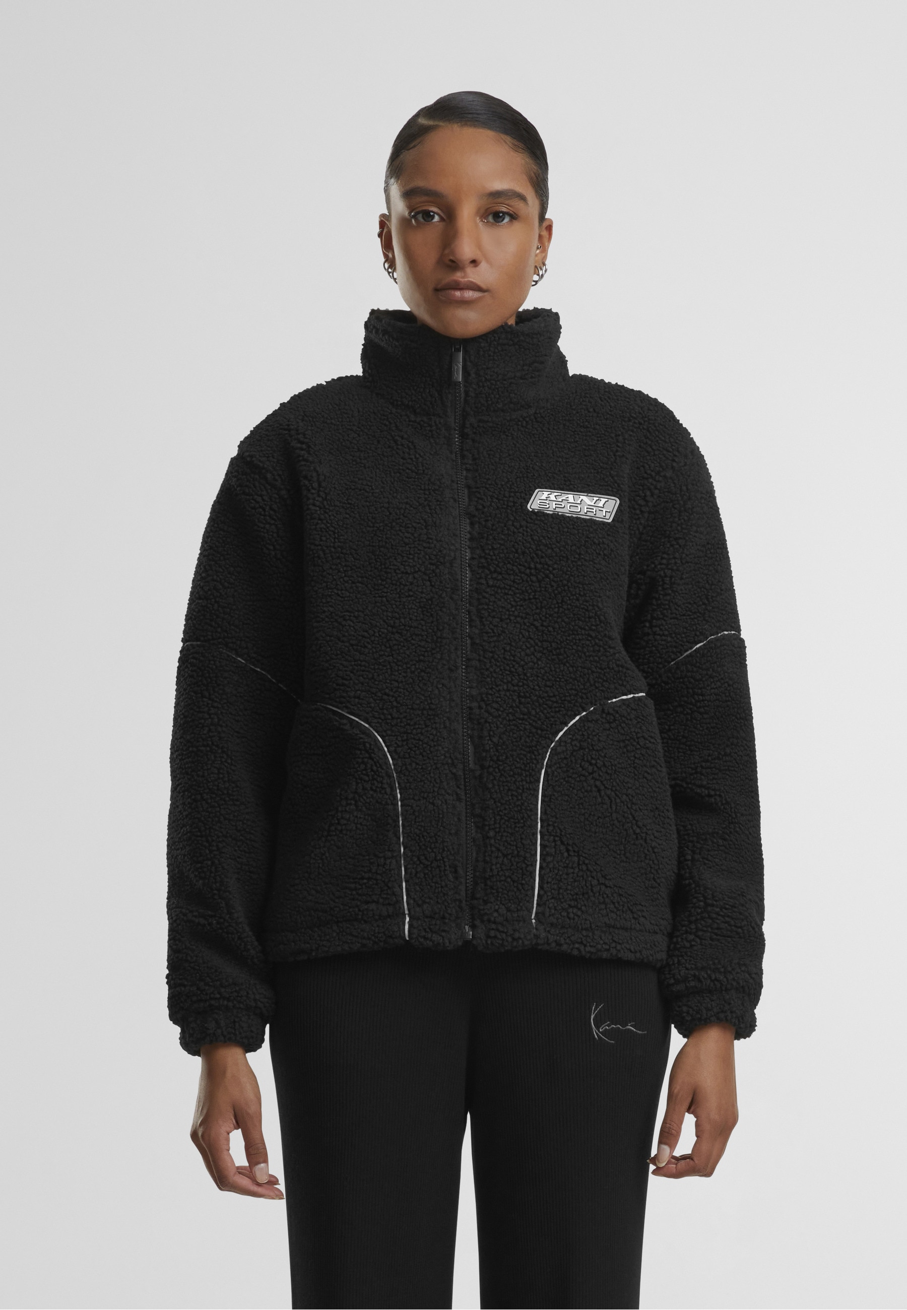 Karl Kani Trainingsjacke »Karl Kani Karl Kani Sport Patch Teddy Block Trackjacket« 1 Stk. tlg. ohne Kapuze