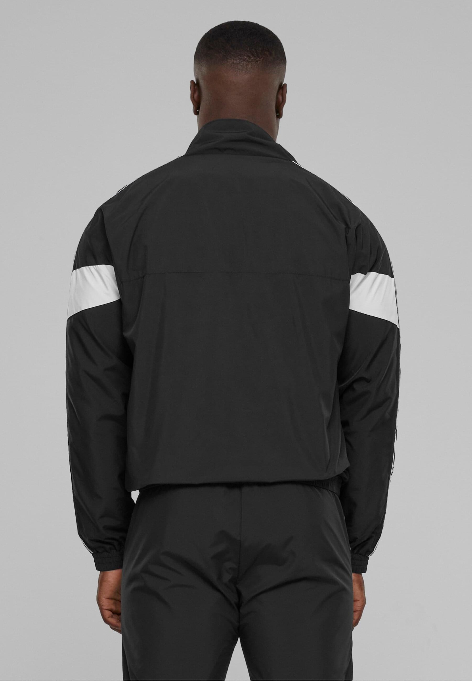 Karl Kani Allwetterjacke »Karl Kani Herren KKMQ32024BLK KK Retro Tape Trackjacket«, (1 St.), ohne Kapuze