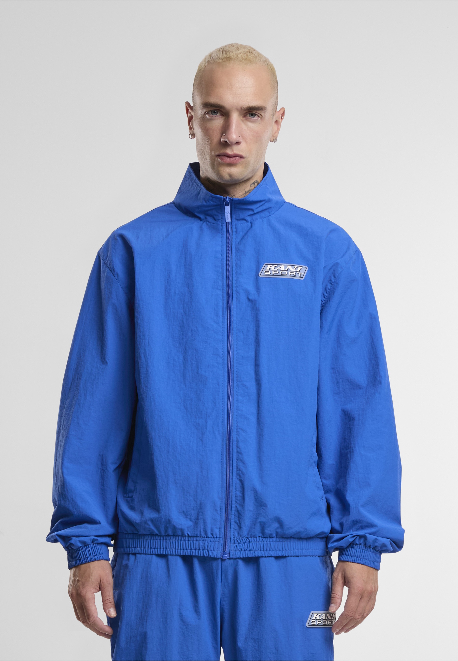 Karl Kani Trainingsjacke »Karl Kani Sport Patch Essential Trackjacket« 1 Stk. tlg. ohne Kapuze