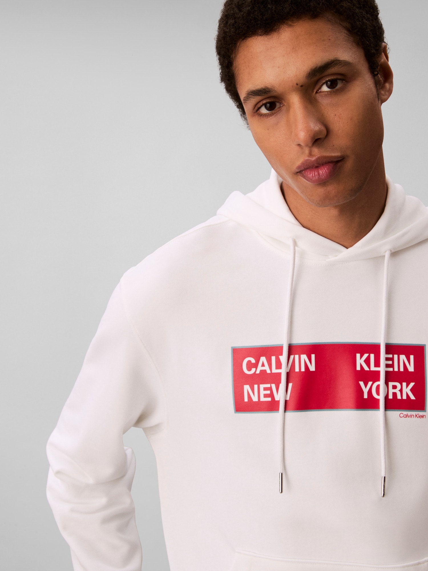 Calvin Klein Jeans Kapuzensweatshirt »LS EU 350TERRY CKNY BOX GRAPHIC«, Mit Rundhalsausschnitt, regular fit