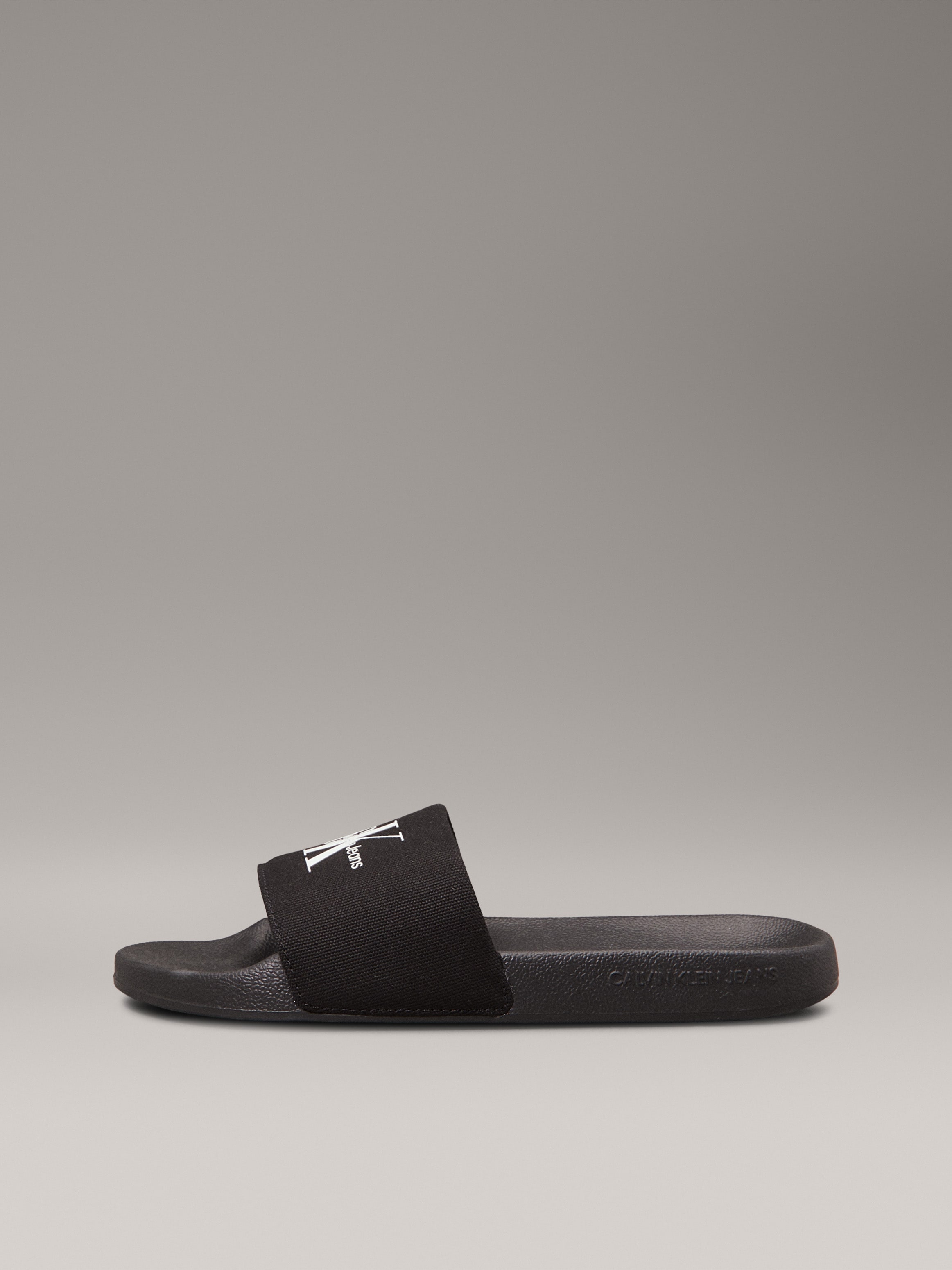 Calvin Klein Jeans Pantolette »SLIDE MONOGRAM WMNS«, Poolslides, Schlappen, Sommerpantolette, Strandschuh zum Schlupfen