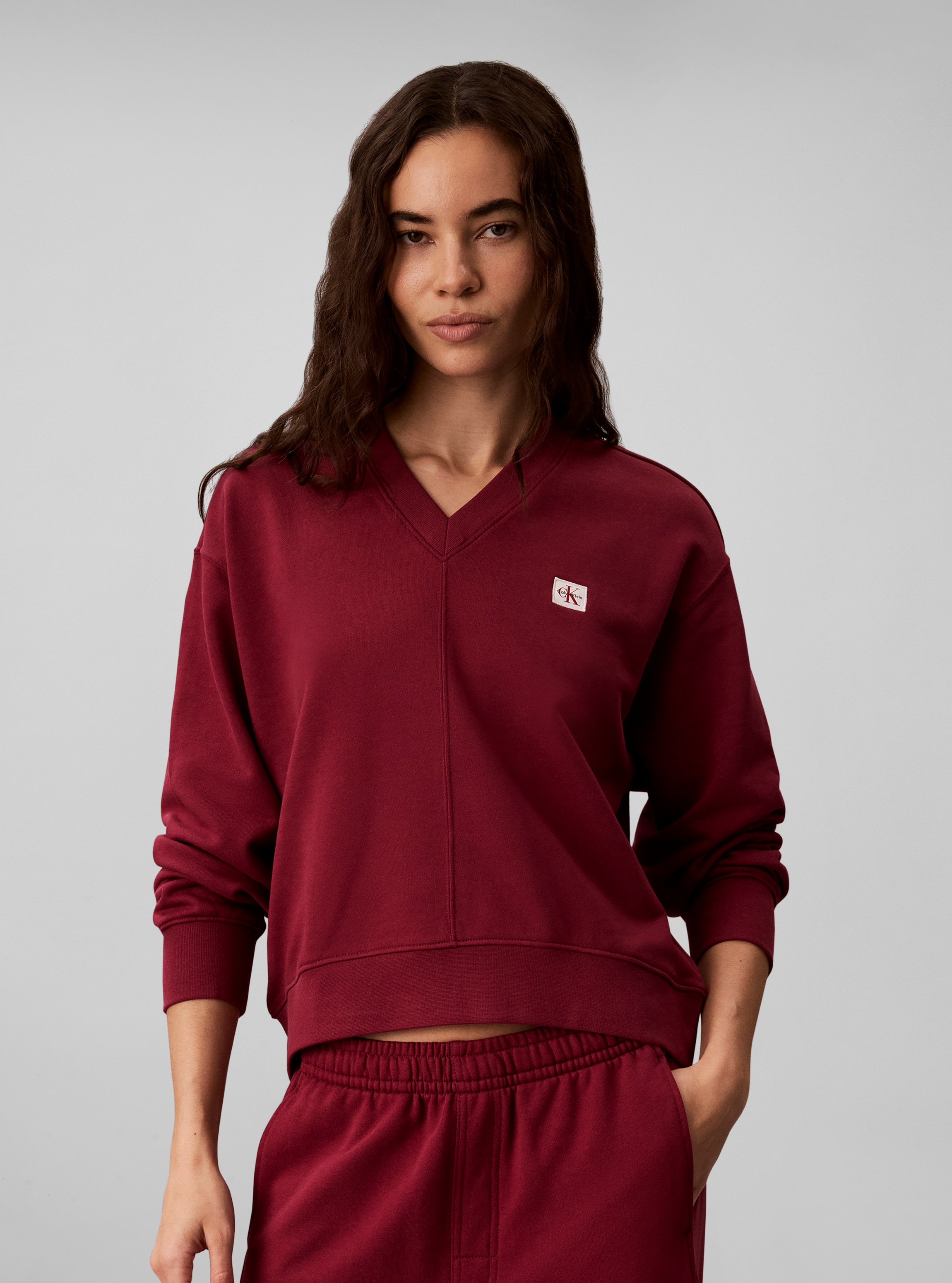 Calvin Klein Jeans Sweatshirt "LS TERRY WOVEN LABEL VNK SWEATSH", Regular fit mit V-Ausschnitt