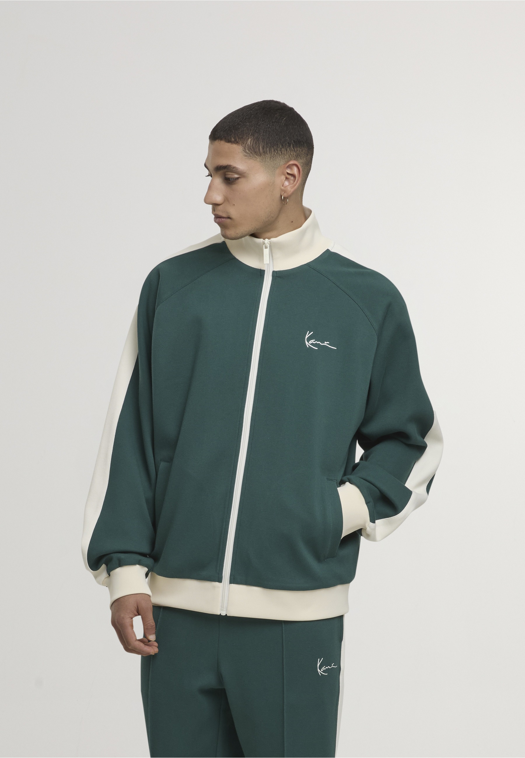 Karl Kani Outdoorjacke »Karl Kani Signature Sidestripe Pique Trackjacket« 1 Stk. tlg. ohne Kapuze