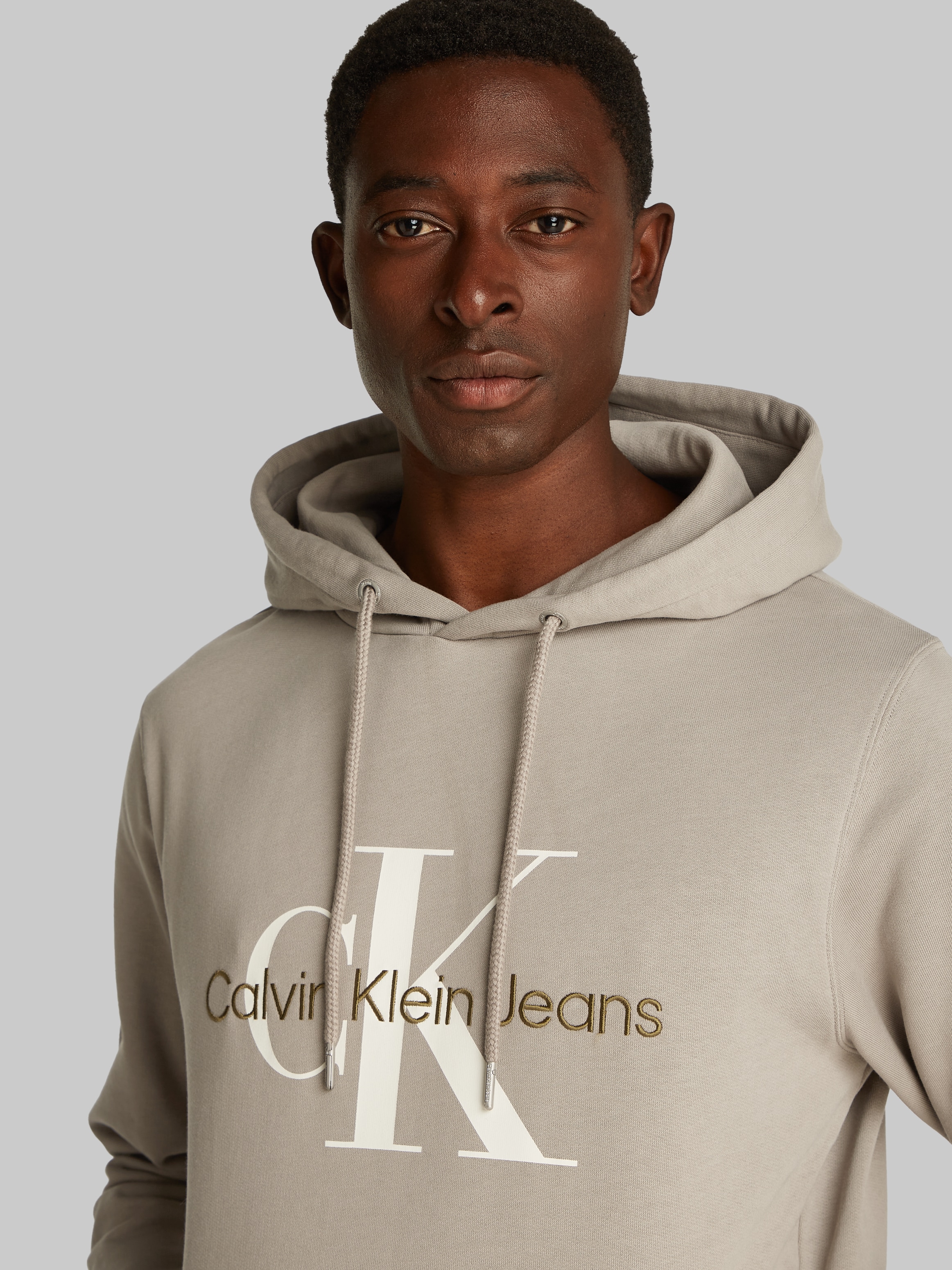 Calvin Klein Jeans Kapuzensweatshirt »SEASONAL MONOLOGO REGULAR HOODIE«, mit Logodruck und Stickerei