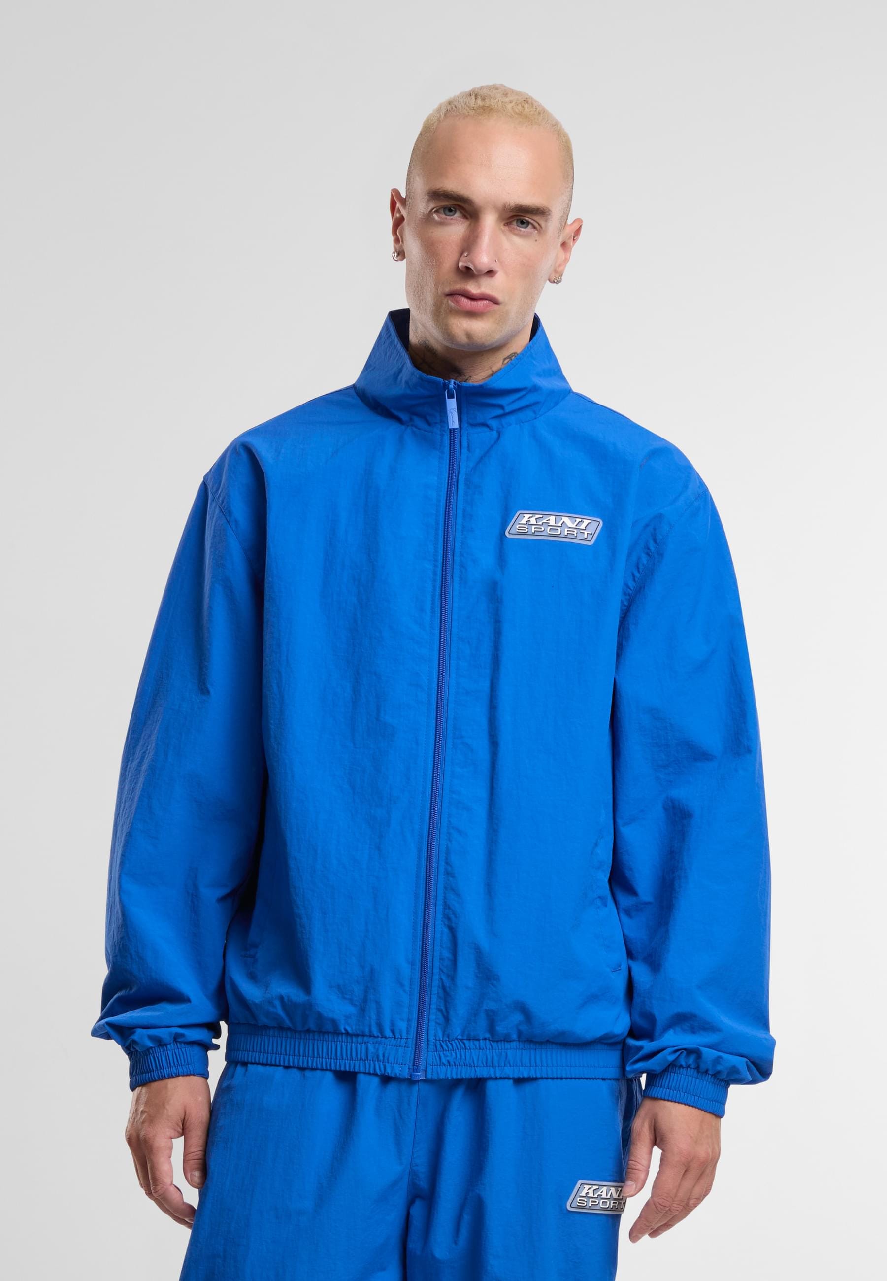 Karl Kani Trainingsjacke »Karl Kani Sport Patch Essential Trackjacket«, (1 St.), ohne Kapuze