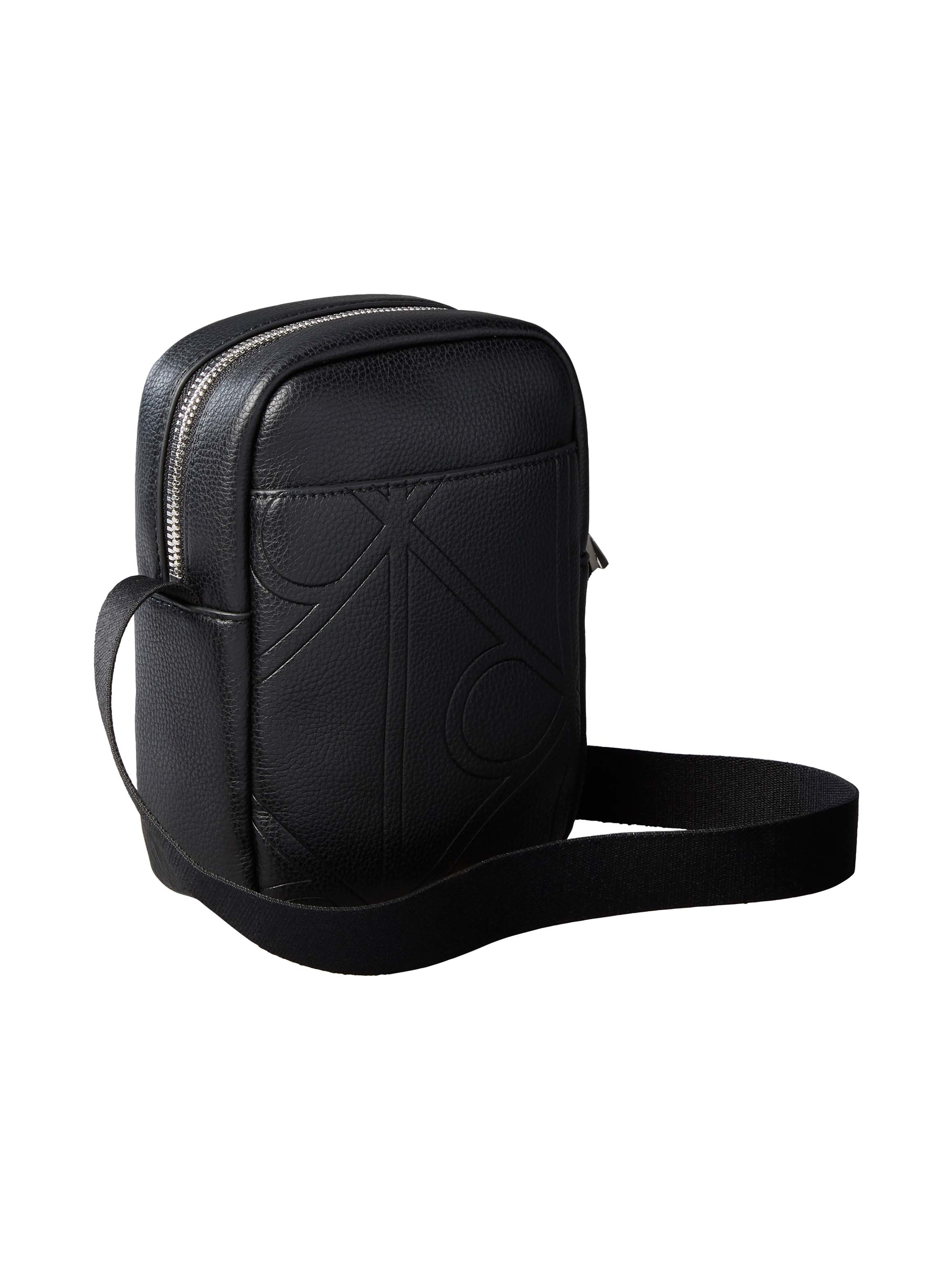 Calvin Klein Umhängetasche »EMBLEM AOP EMBOSS SLIM REPORTER« Schultertasche, Mini Bag mit CK-Logoschriftzug