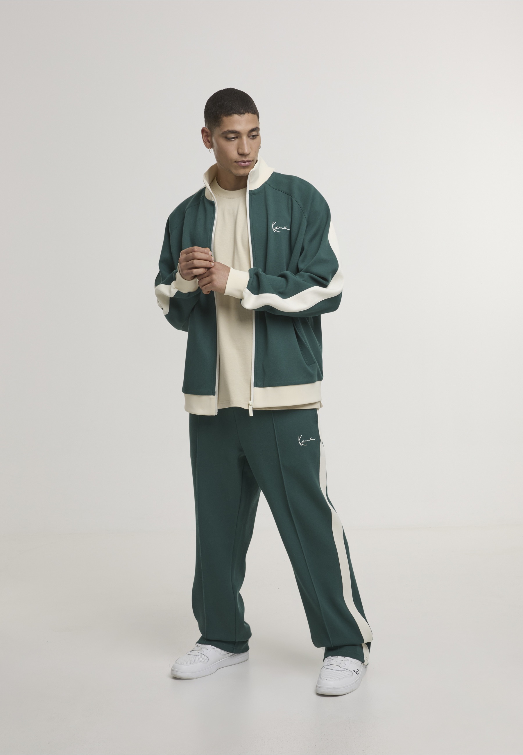 Karl Kani Outdoorjacke »Karl Kani Signature Sidestripe Pique Trackjacket« 1 Stk. tlg. ohne Kapuze