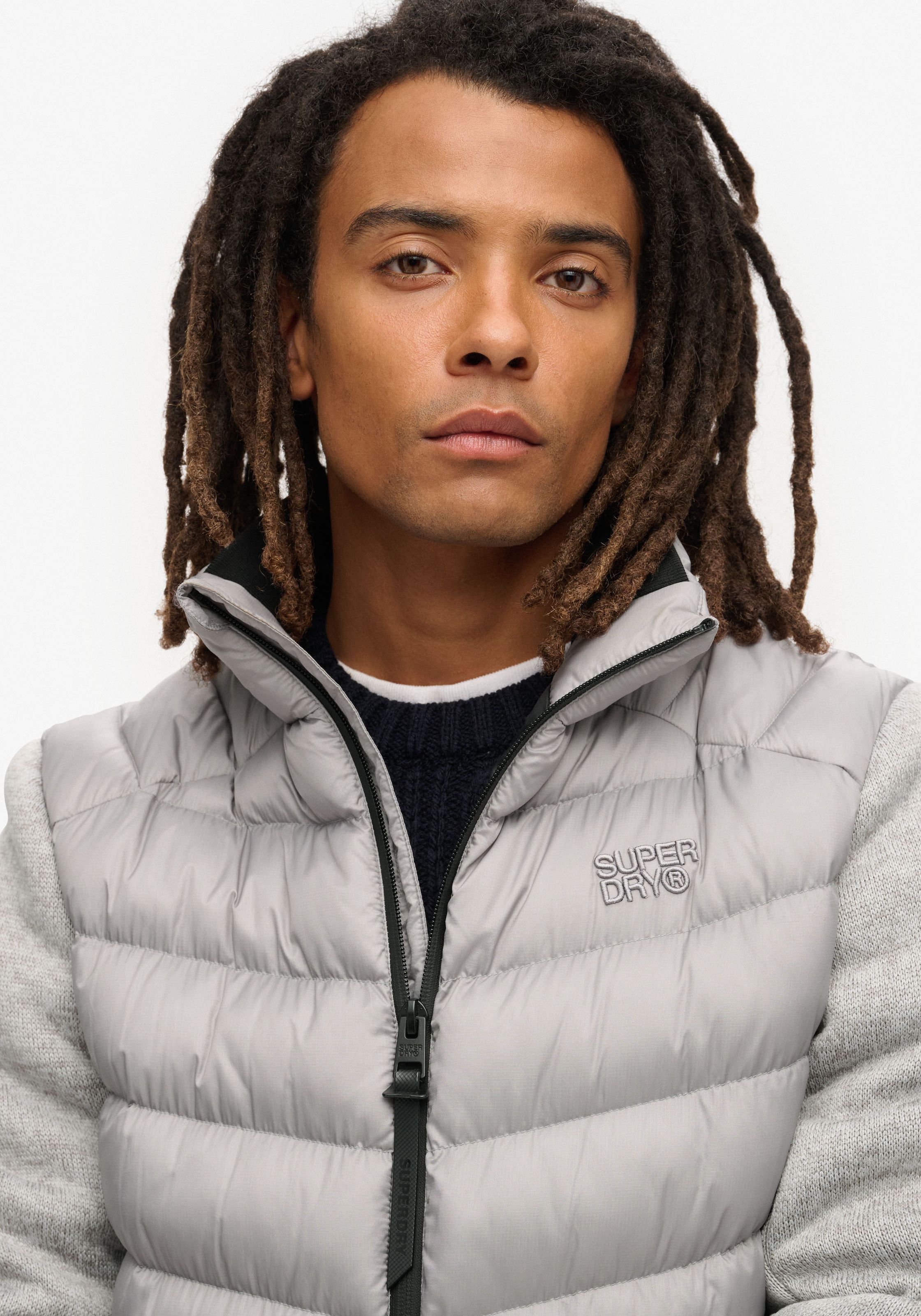 Superdry Steppjacke »STORM KNIT HYBRID PADDED JKT«, mit Kapuze