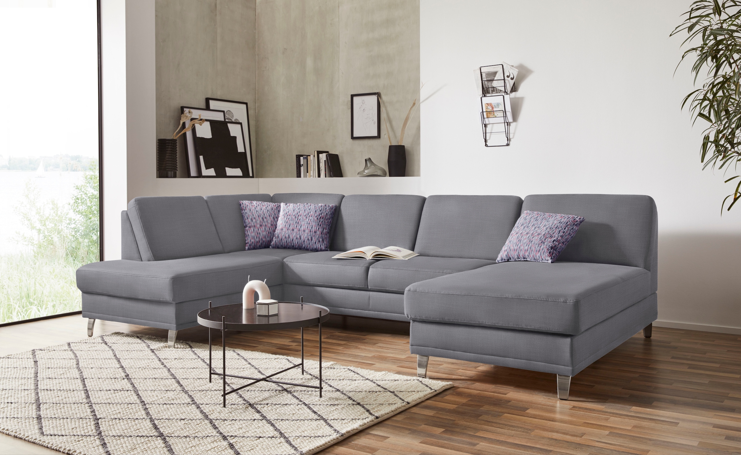 Sofa »Clio U-Form« patogi su miegojimo funkcija ir Dėžutė patalynei su spyruoklės
