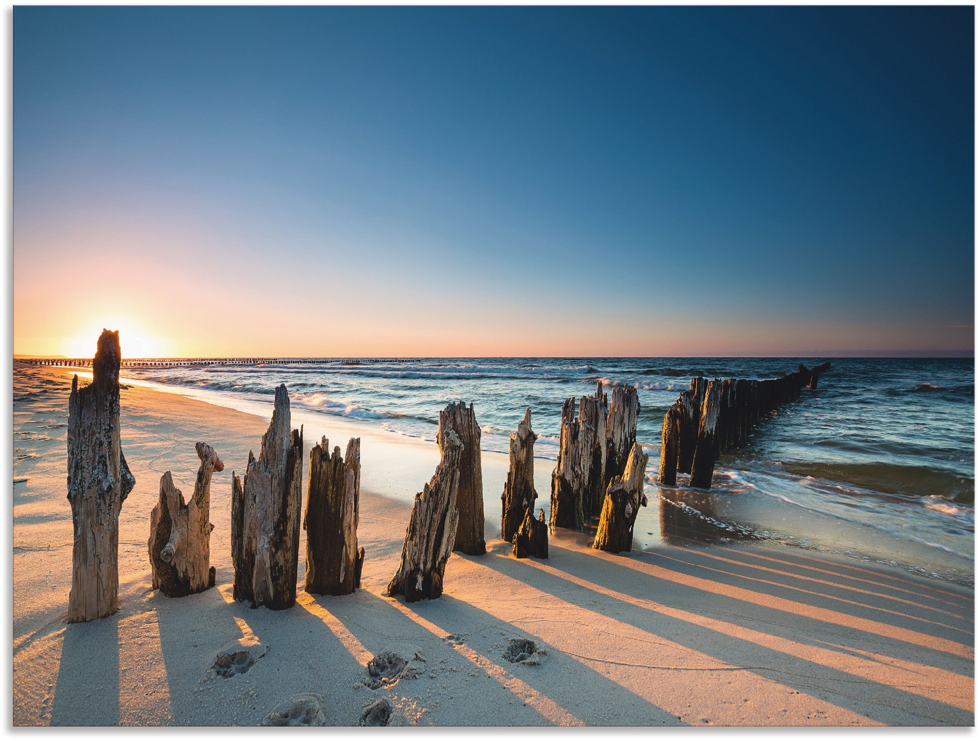 Artland Wandbild »Sonnenuntergang Strand Wellenbrecher«, Meer Bilder, (1 St.),  als Alubild, Leinwandbild, Wandaufkleber oder Poster in versch. Größen  bestellen | BAUR | Poster