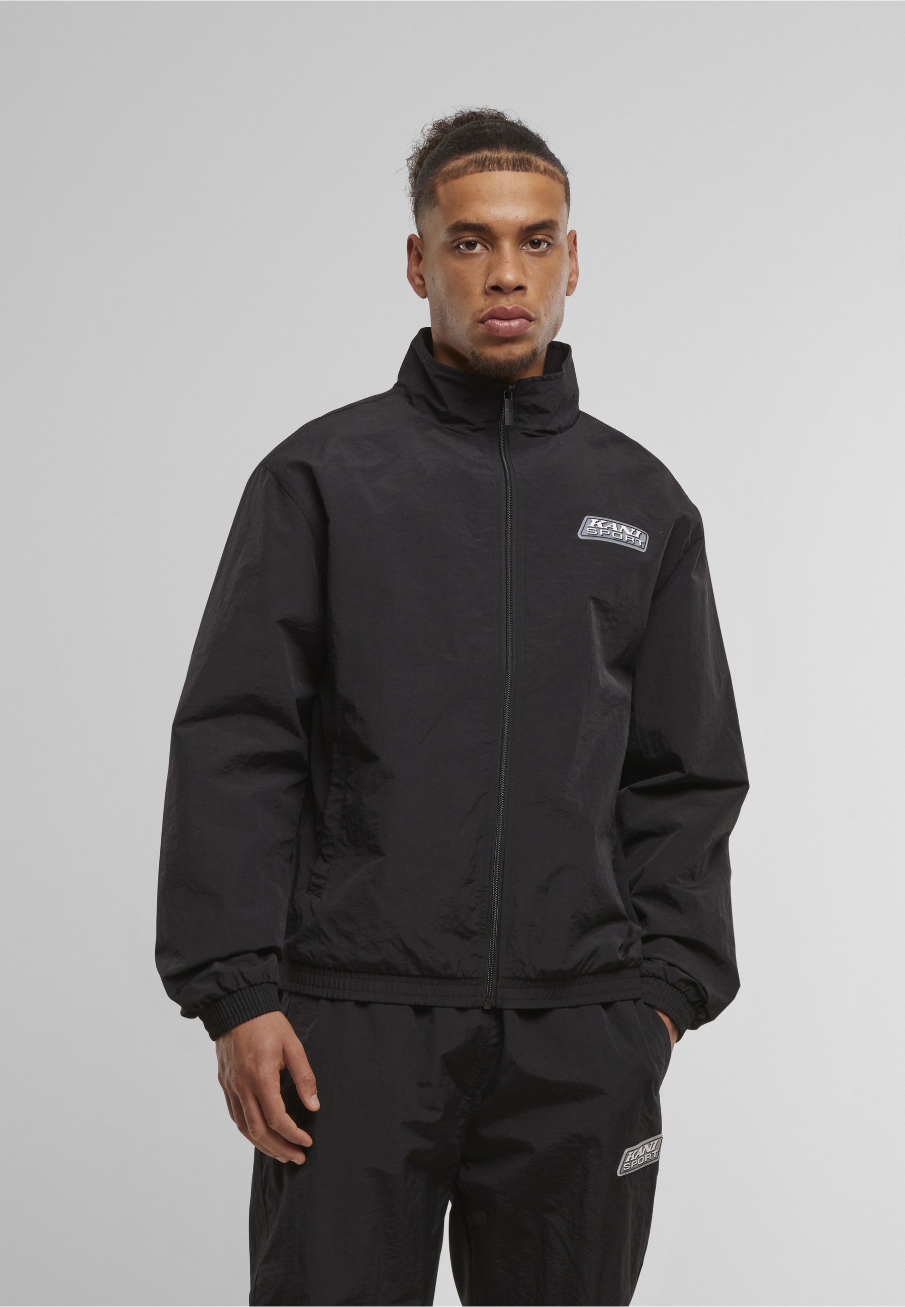 Karl Kani Trainingsjacke »Karl Kani Sport Patch Essential Trackjacket« 1 Stk. tlg. ohne Kapuze