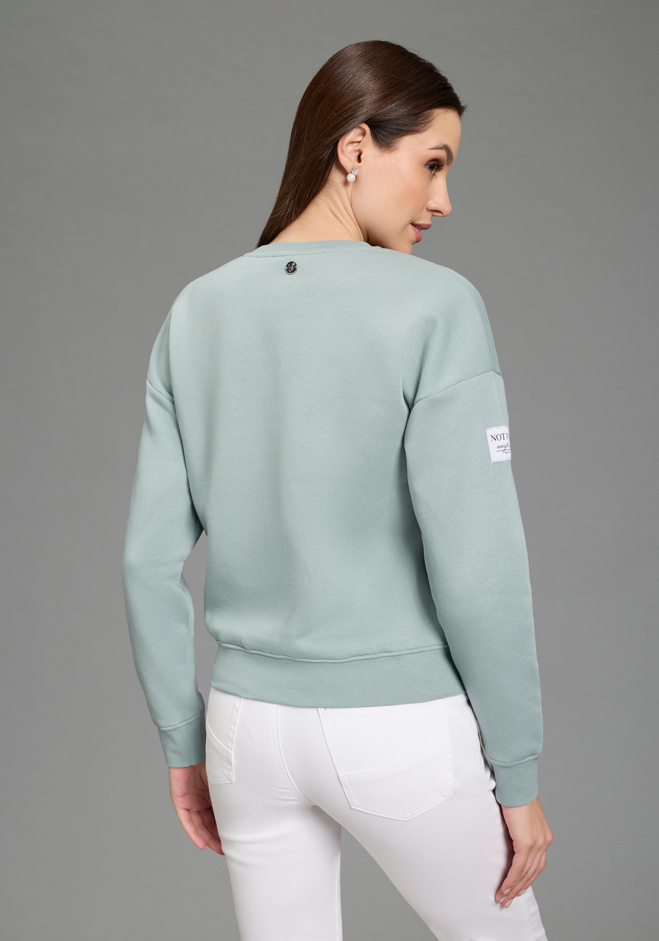 Bruno Banani Sweatshirt, mit Rundhalsausschnitt und platzierten Weblabels günstig online kaufen
