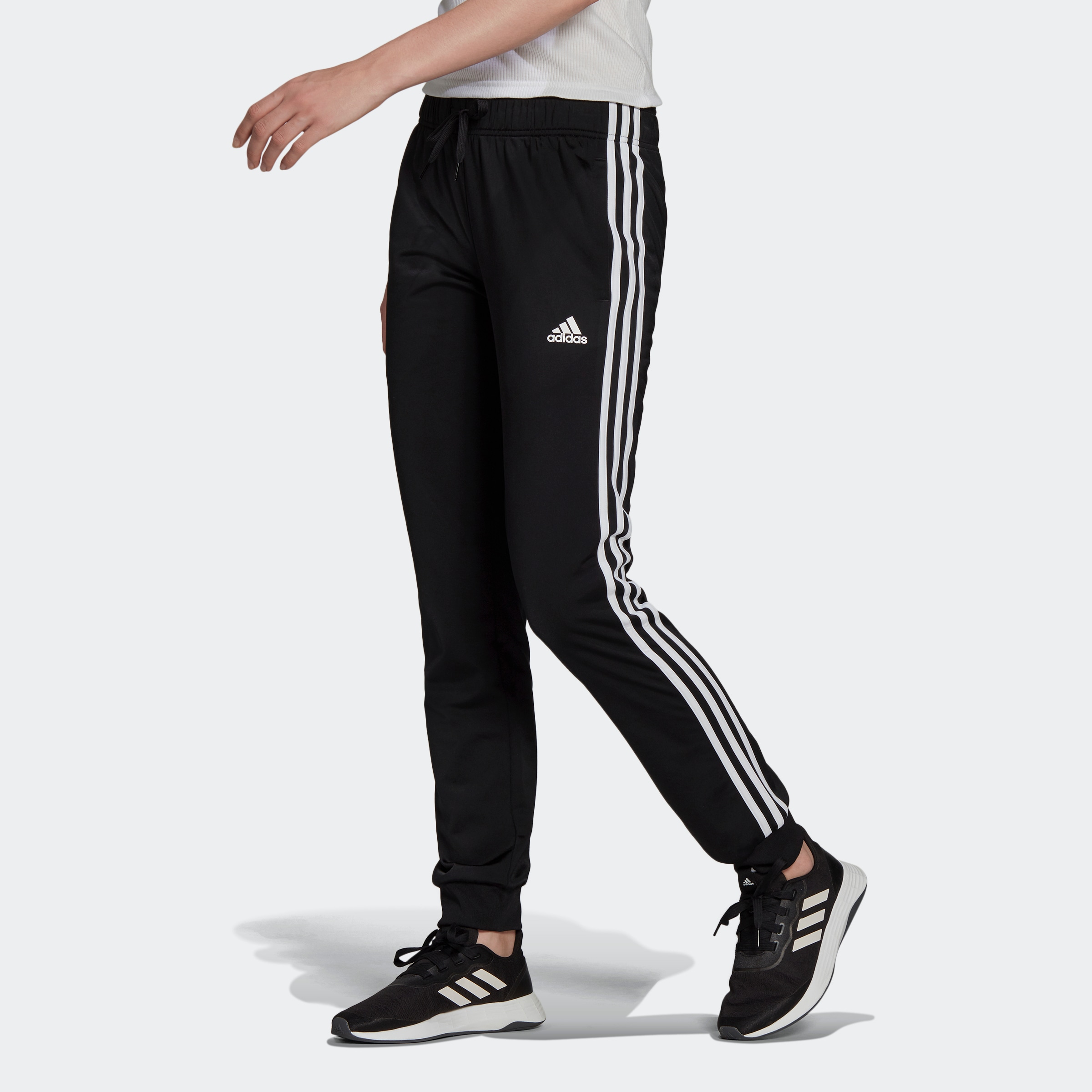 BAUR adidas ESSENTIALS TAPERED | WARMUP 3STREIFEN«, »PRIMEGREEN SLIM Sportswear Sporthose (1 tlg.)