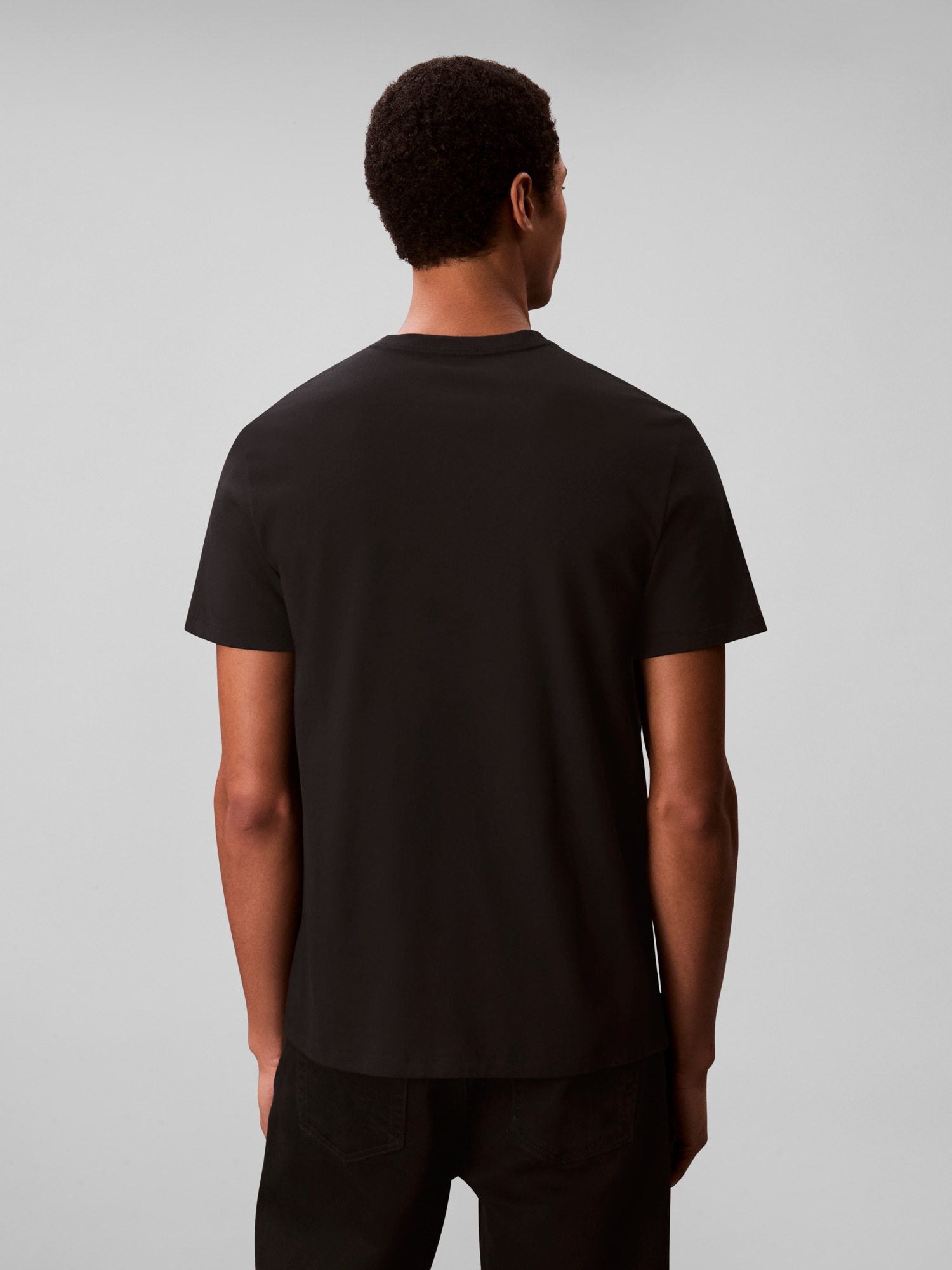 Calvin Klein Jeans T-Shirt »SS 30S EU CK CALVIN GRAPHIC TEE«, Mit Rundhalsausschnitt, regular fit