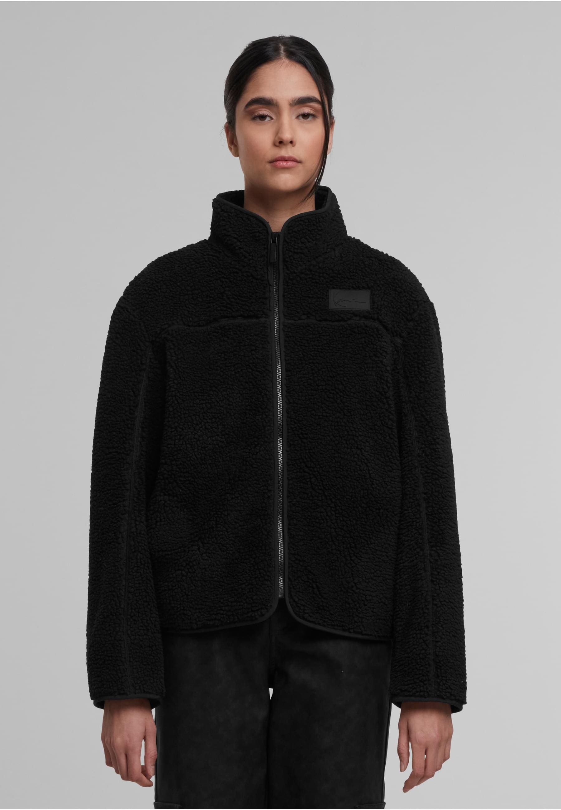 Karl Kani Trainingsjacke »Karl Kani Signature Teddy Trackjacket« 1 Stk. tlg. ohne Kapuze