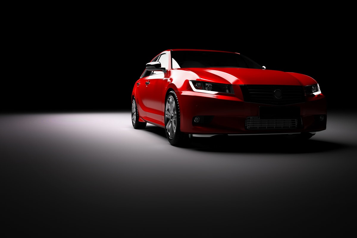 Papermoon Fototapete »Rotes Auto im Rampenlicht«