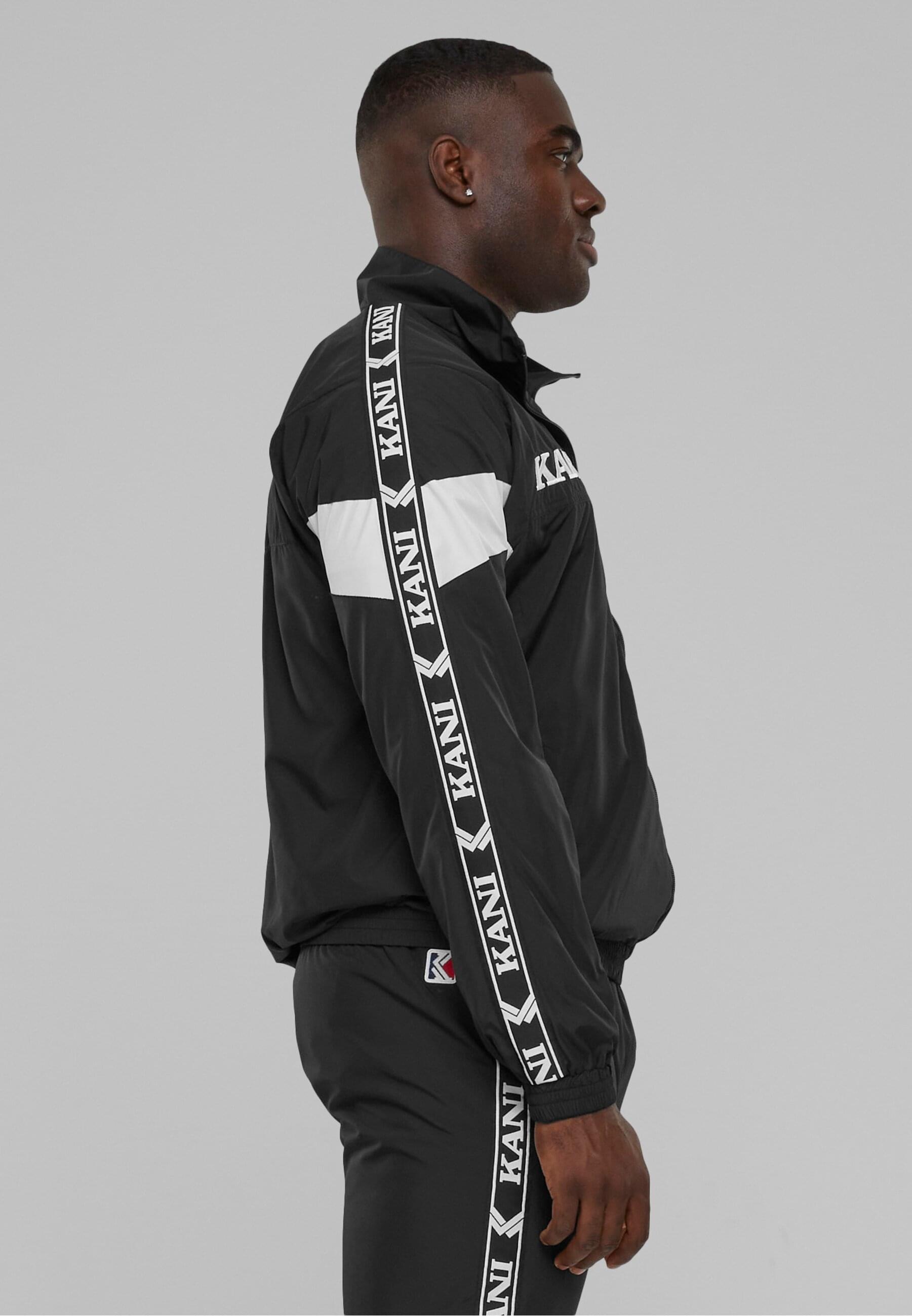 Karl Kani Allwetterjacke »Karl Kani Herren KKMQ32024BLK KK Retro Tape Trackjacket«, (1 St.), ohne Kapuze