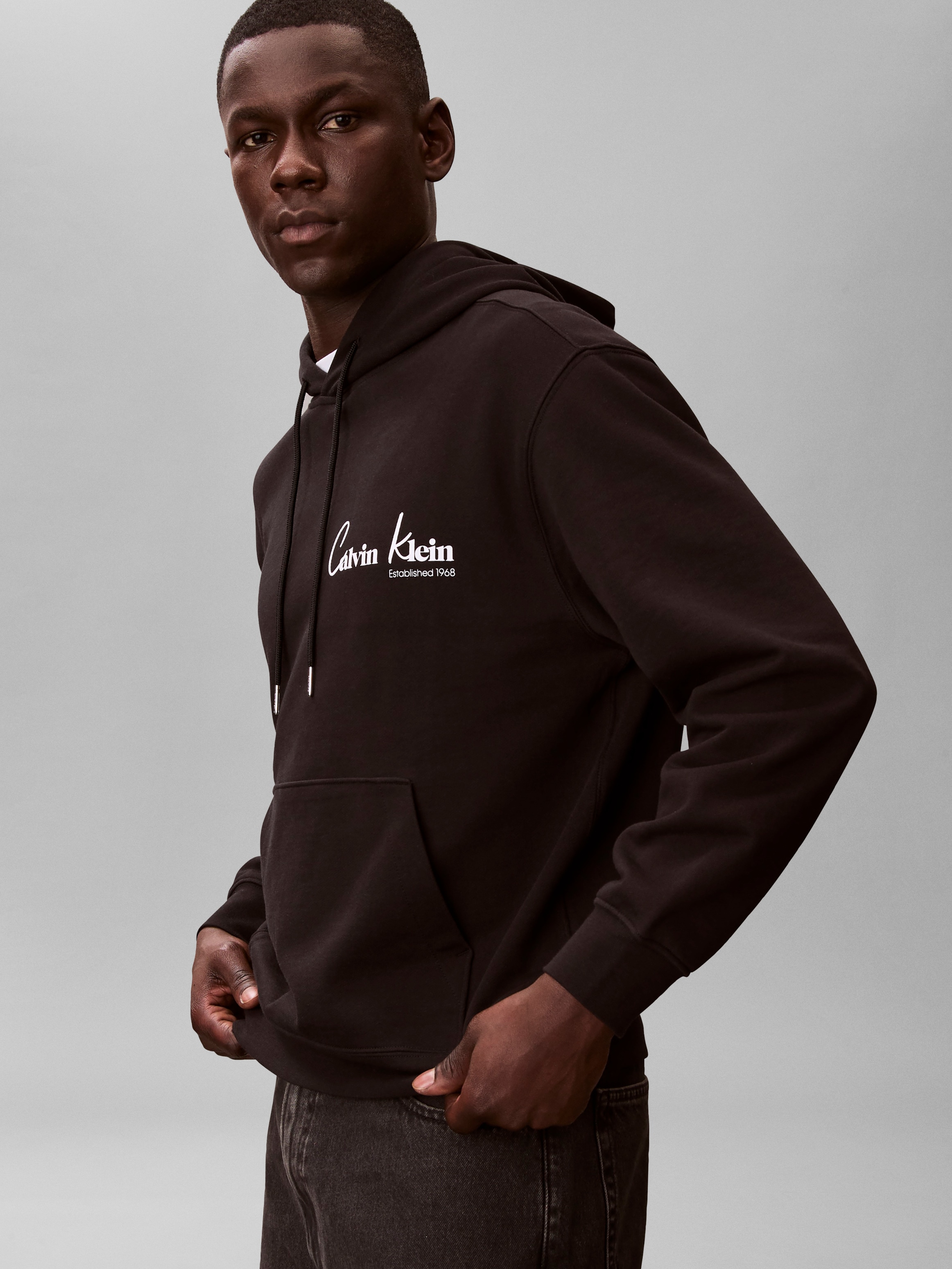 Calvin Klein Jeans Kapuzensweatshirt »GRAPHIC HOODIE«, Regular fit mit Markenprint
