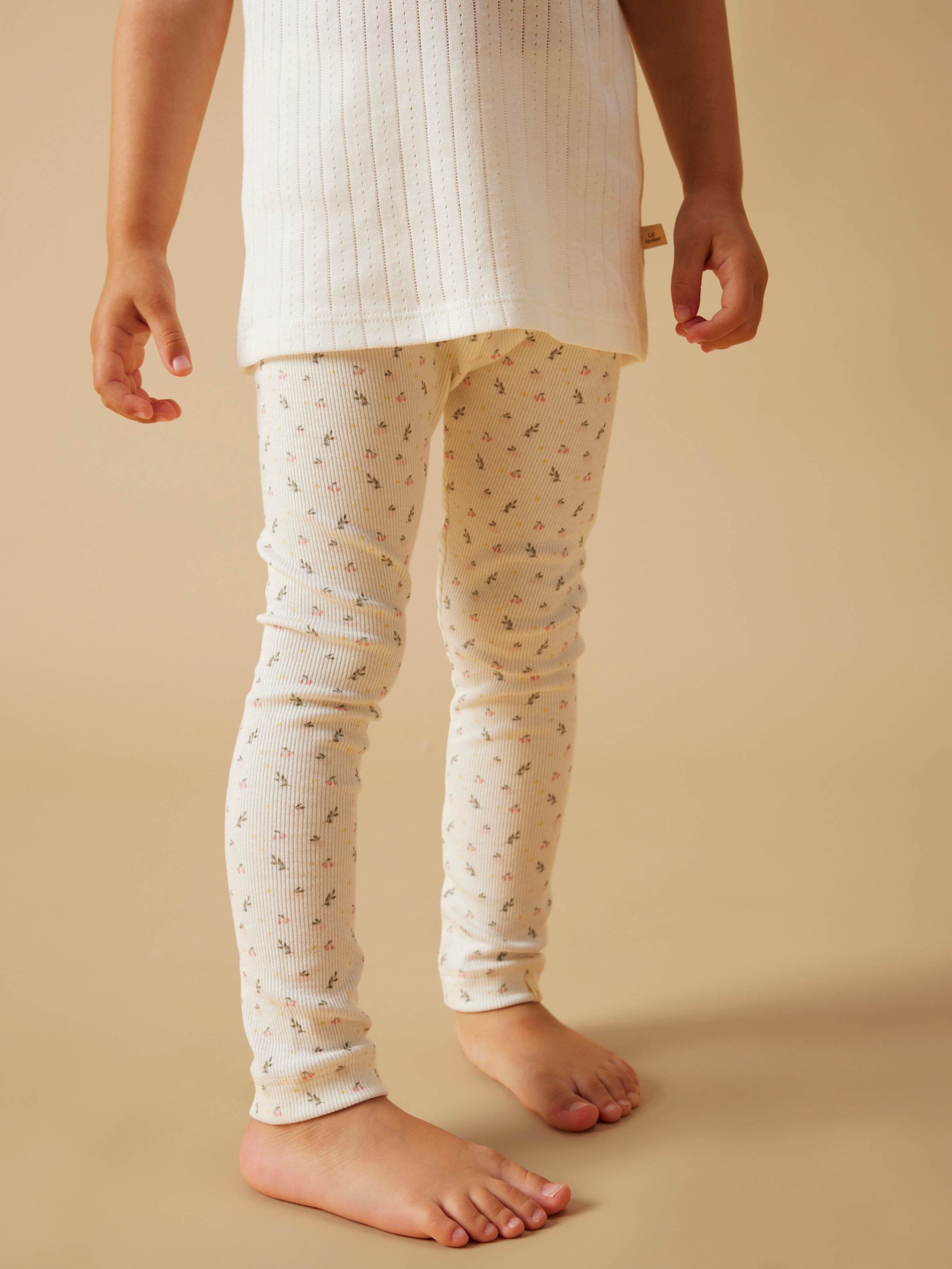 Leggings LIL' ATELIER "NMFGAGO SLIM LEGGING LIL NOOS", Mädchen, Gr. 92, N-Gr, coconut milk aop:small flower, Jersey, Obermaterial: 57% Baumwolle, 38% Lyocell, 5% Elasthan, bedruckt, slim fit lang, Hosen Leggings, weiche Jersey Rippqualität