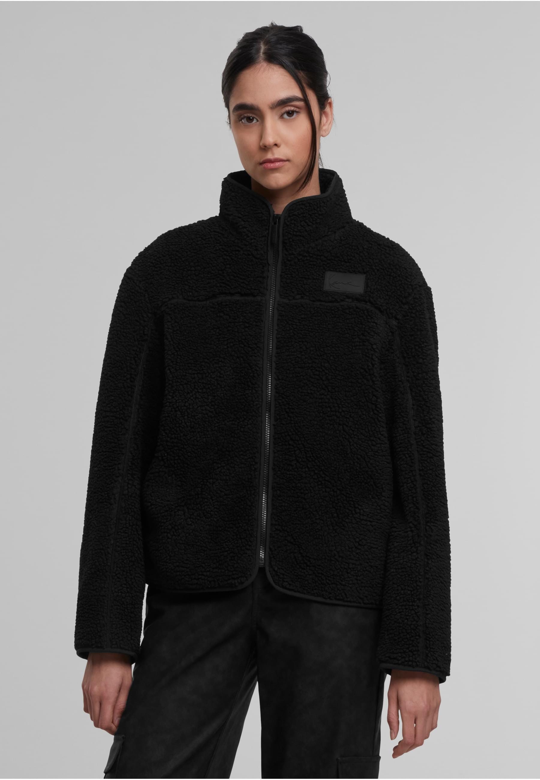 Karl Kani Trainingsjacke »Karl Kani Signature Teddy Trackjacket« 1 Stk. tlg. ohne Kapuze