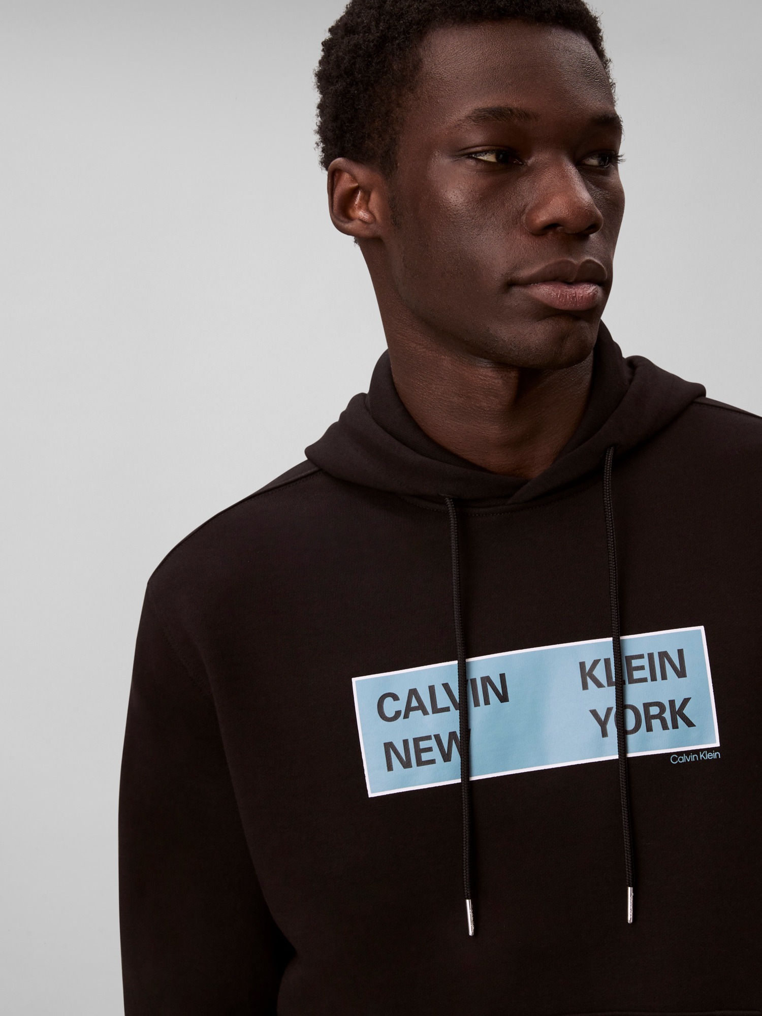 Calvin Klein Jeans Kapuzensweatshirt »LS EU 350TERRY CKNY BOX GRAPHIC«, Mit Rundhalsausschnitt, regular fit
