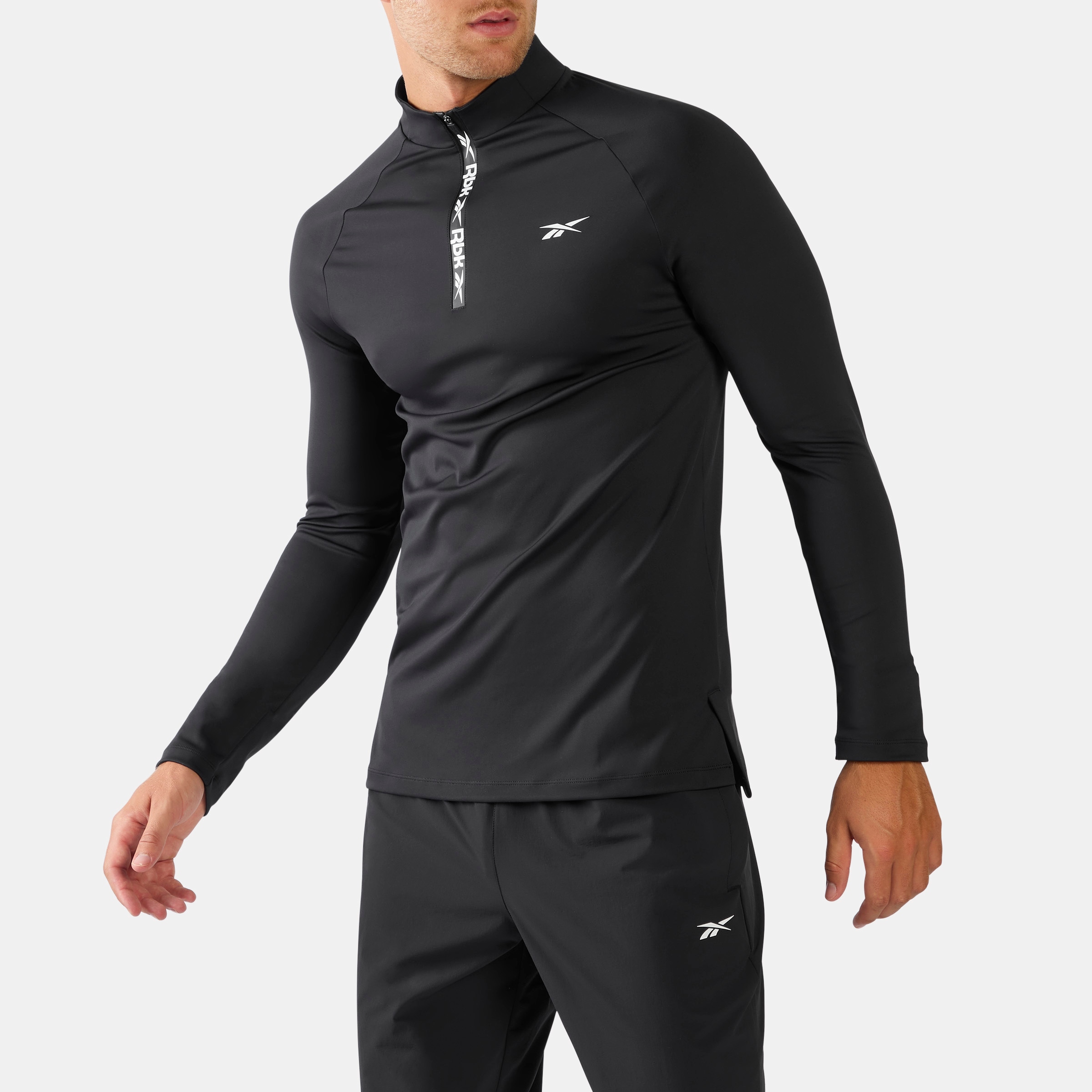 Reebok Trainingsshirt "ID RBK TRAINING 1/4 ZIP" mit Rundhalsausschnitt, aus Polyester und Elasthan, in normaler Länge