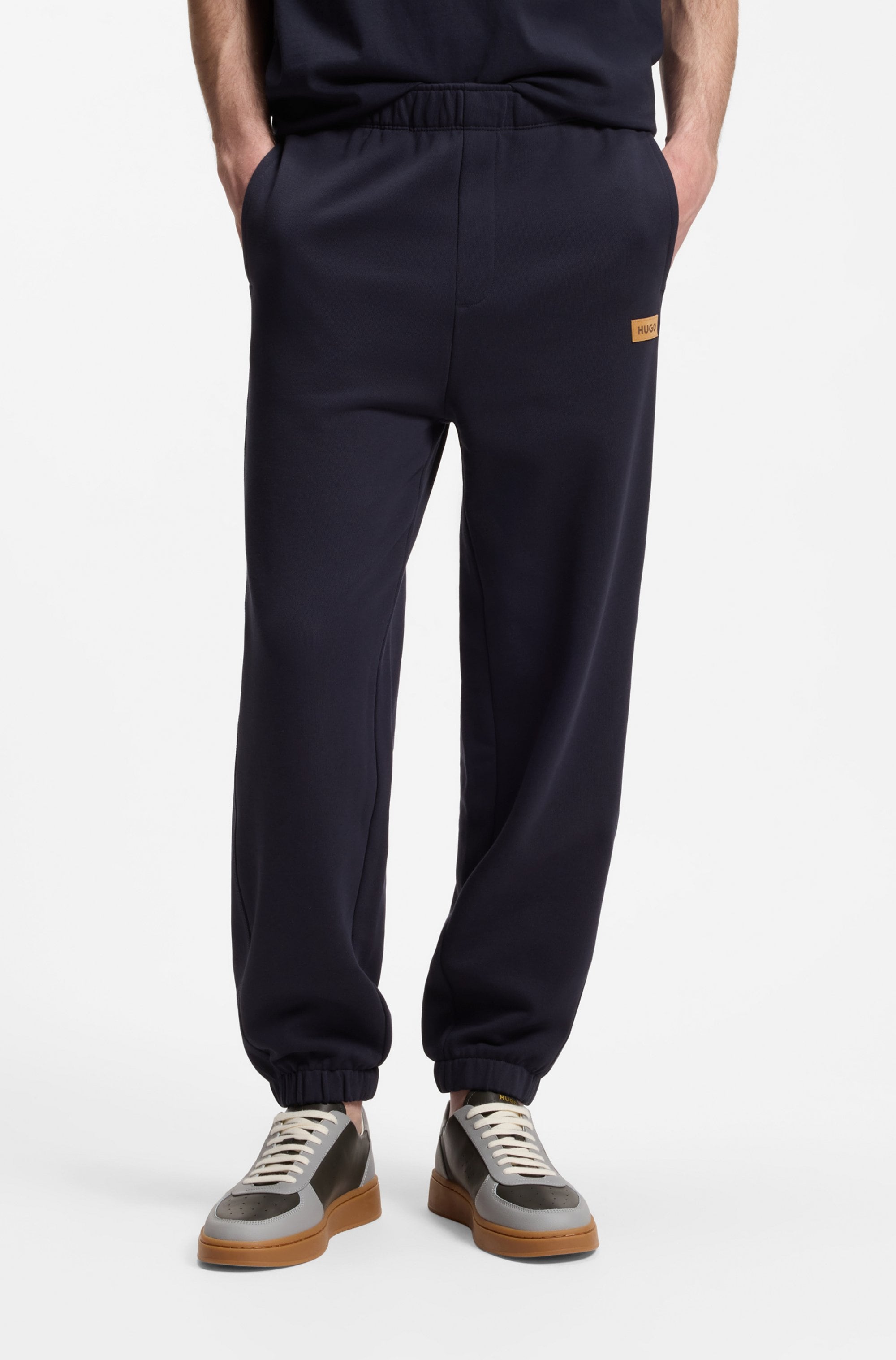 HUGO Sweathose "Nevatro" Regular Fit, Zierhosenschlitz, elastische Bündchen