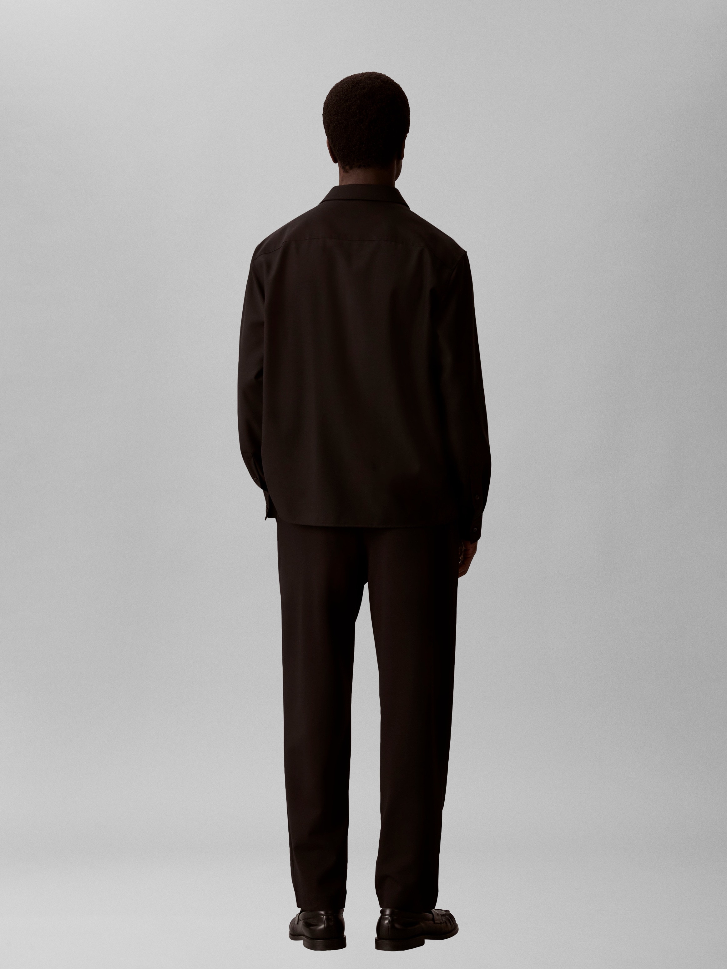 Calvin Klein Jeans Bundfaltenhose »TAPERED TECH KNIT PLEATED PANT«  Regular fit mit elastischem Bund