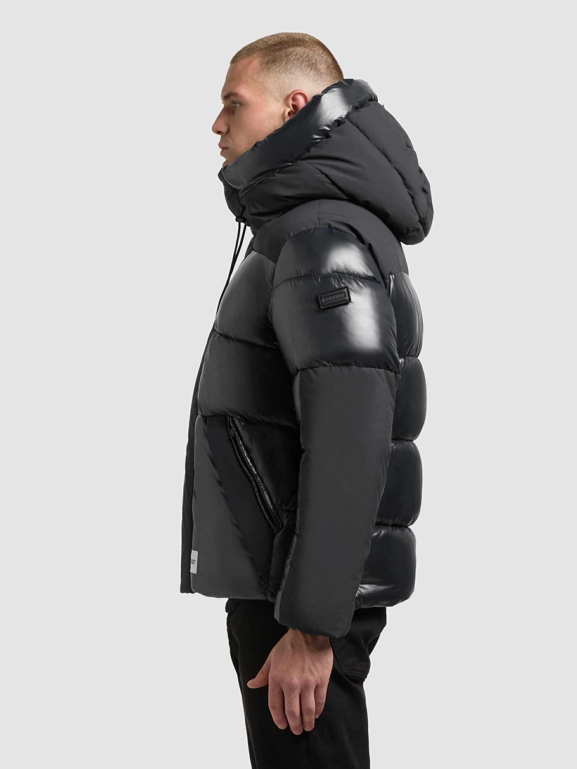 khujo Steppjacke »Alst« mit Kapuze Schimmernde Herren Jacke mit innenliegenden Rucksack-Trägern