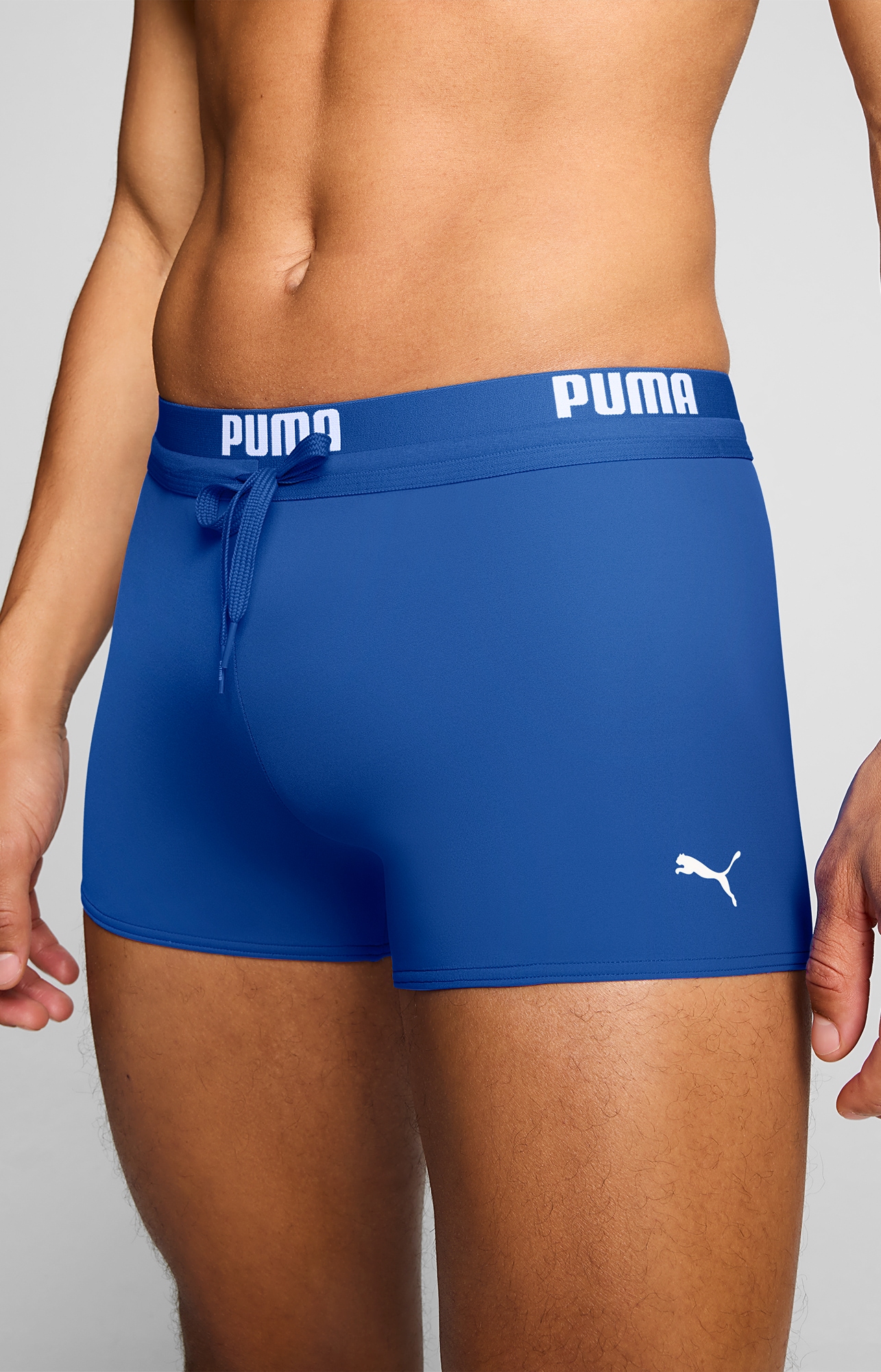 PUMA Badehose »PUMA SWIM MEN LOGO TRUNKS« elastischer Logobund mit integriertem Kordelzug