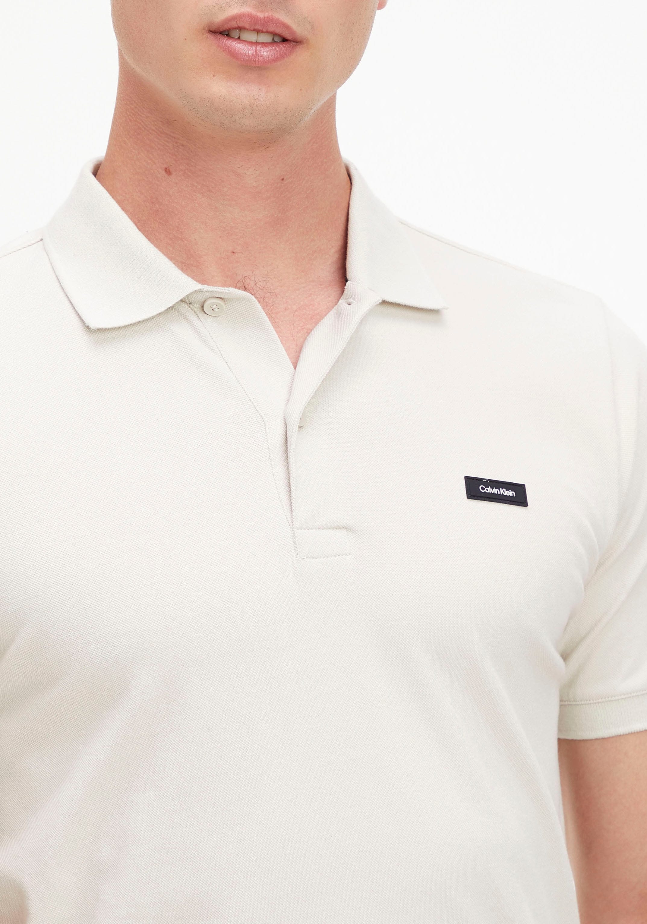 Calvin Klein Poloshirt, mit Calvin auf | Brust Logo bestellen BAUR Klein der ▷