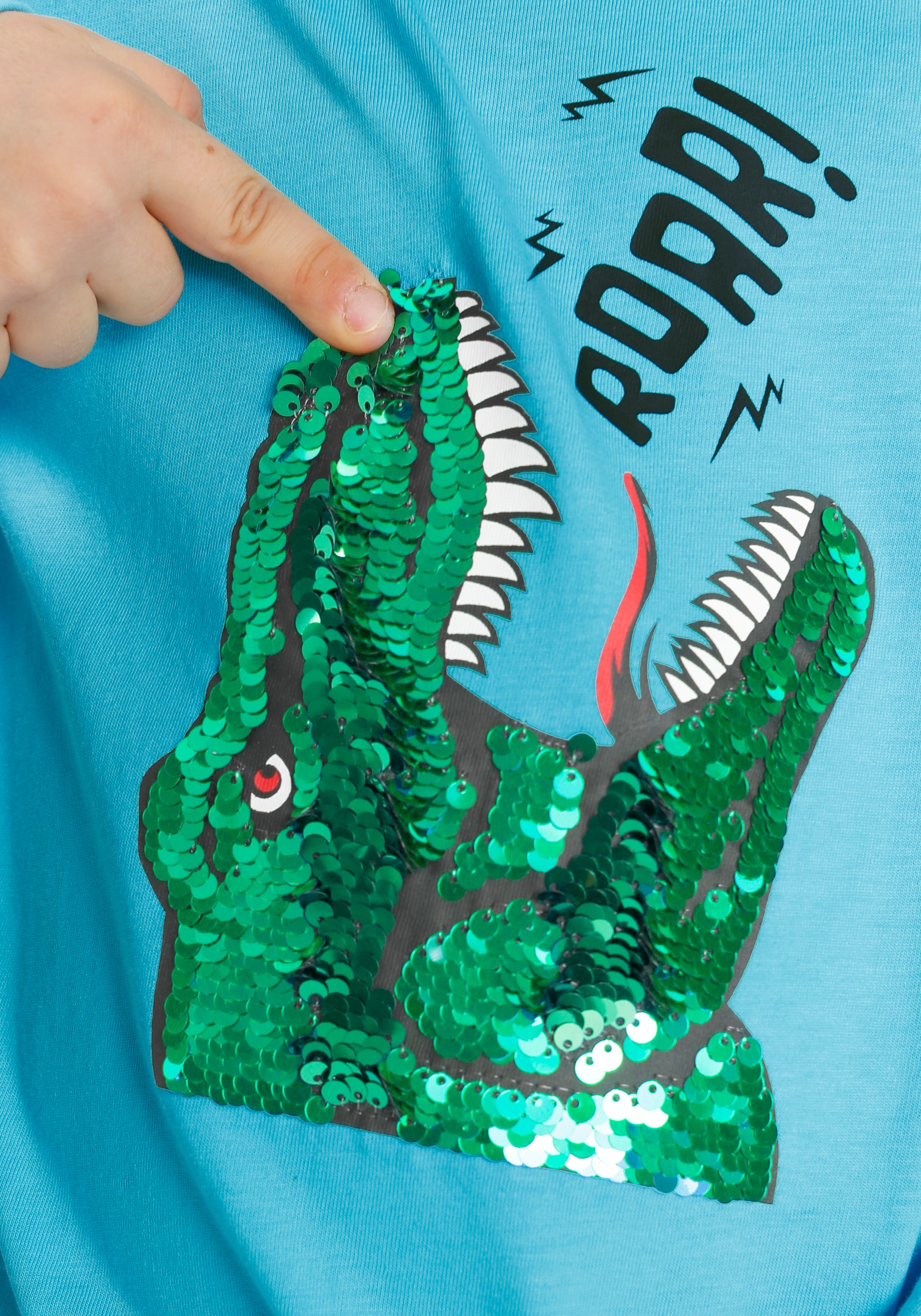 KIDSWORLD Langarmshirt Dino Dino-Motiv unterschiedlichen »mit | BAUR Farben aus Wendepailletten«, in