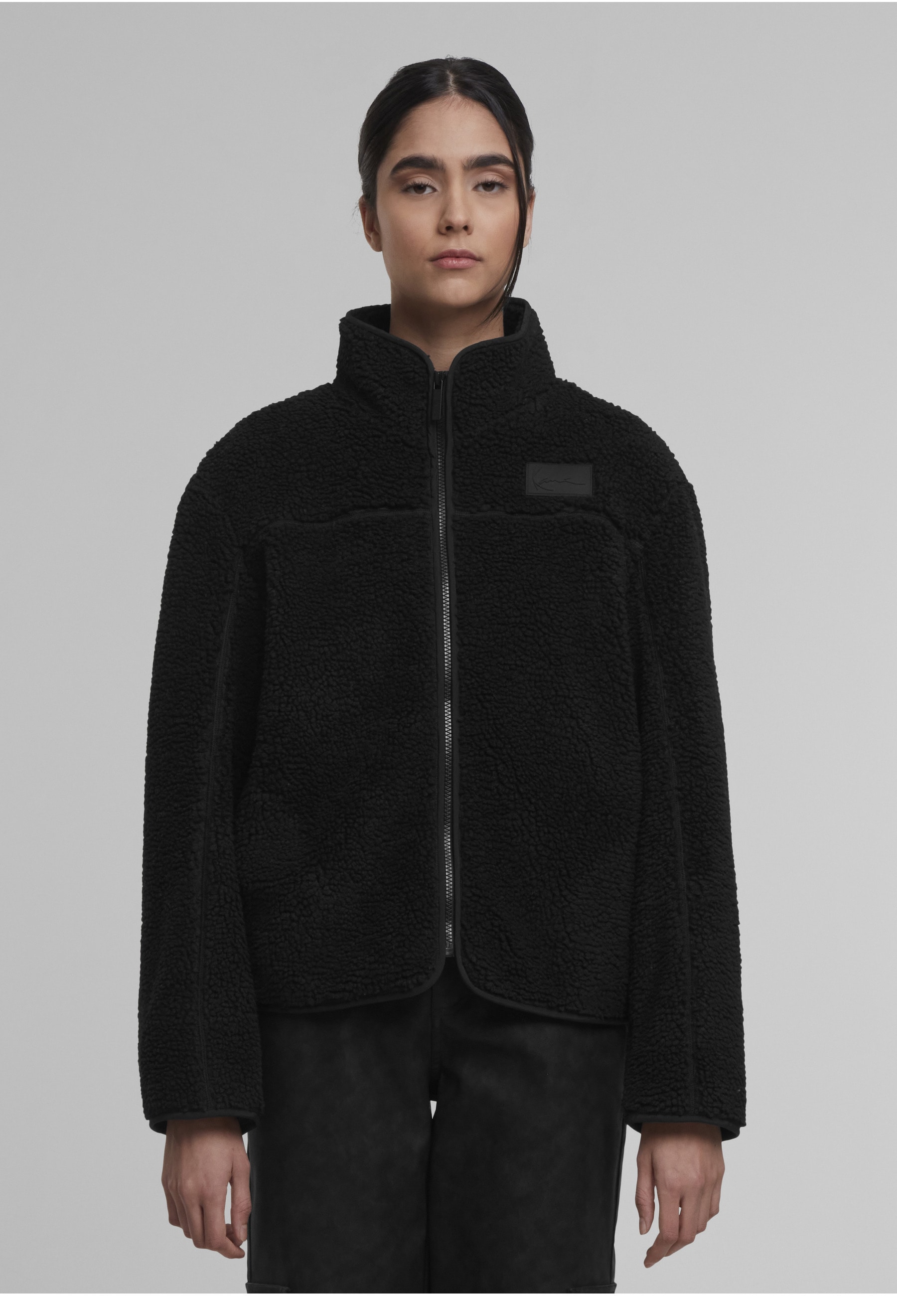 Karl Kani Trainingsjacke »Karl Kani Signature Teddy Trackjacket« 1 Stk. tlg. ohne Kapuze