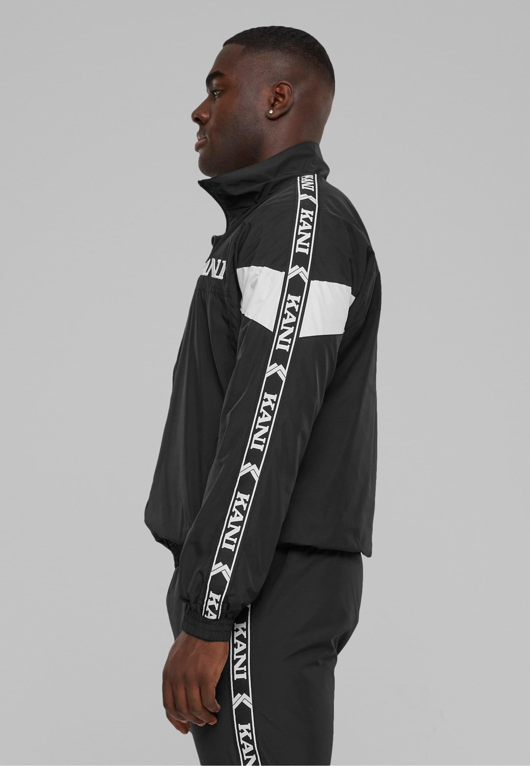 Karl Kani Allwetterjacke »Karl Kani Herren KKMQ32024BLK KK Retro Tape Trackjacket«, (1 St.), ohne Kapuze