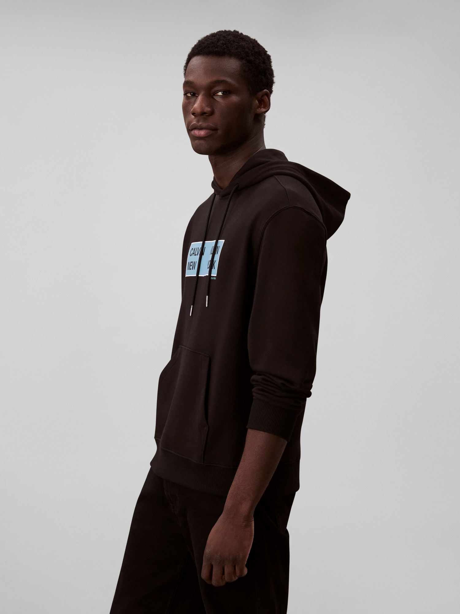 Calvin Klein Jeans Kapuzensweatshirt »LS EU 350TERRY CKNY BOX GRAPHIC«, Mit Rundhalsausschnitt, regular fit