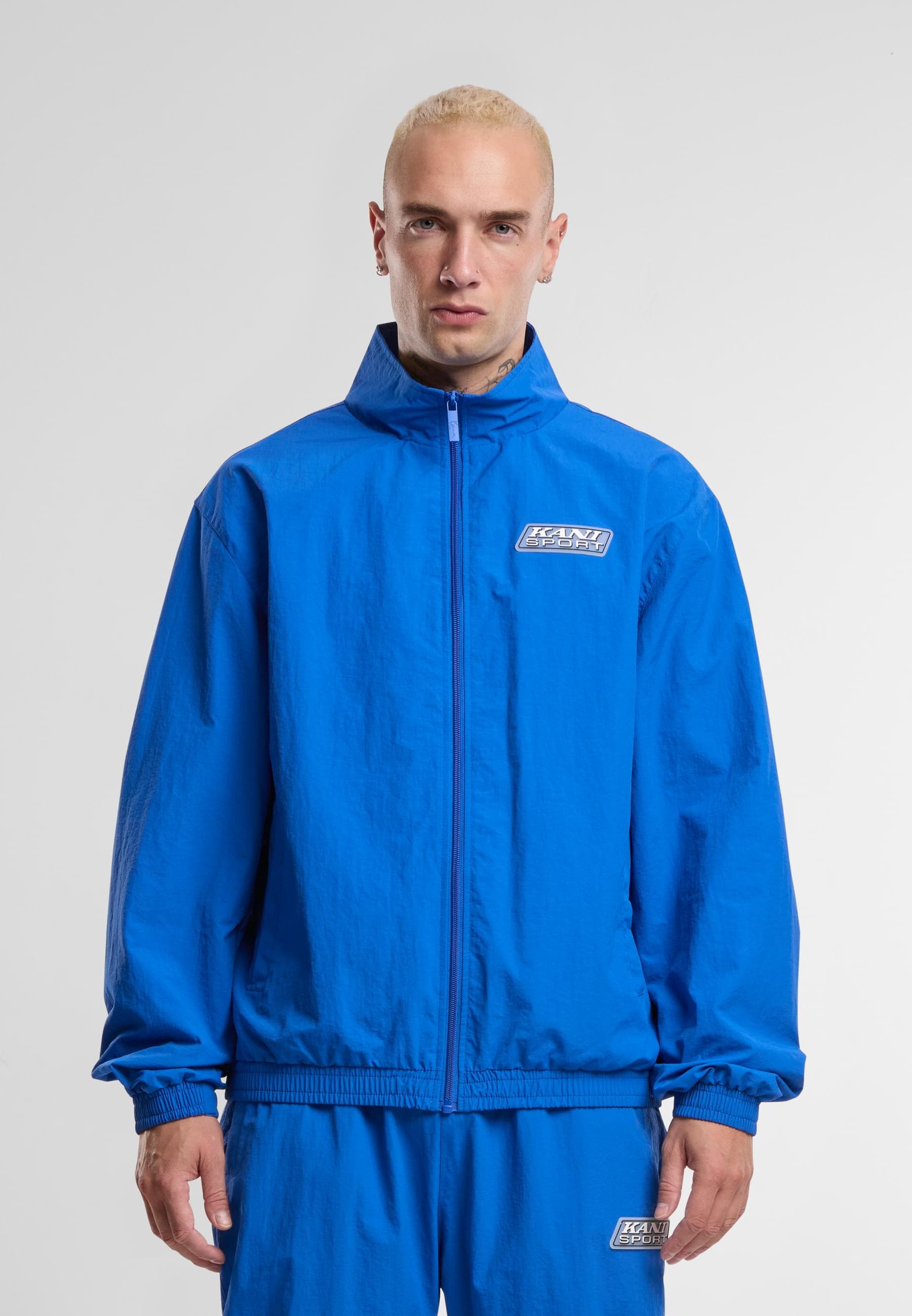 Karl Kani Trainingsjacke »Karl Kani Sport Patch Essential Trackjacket«, (1 St.), ohne Kapuze
