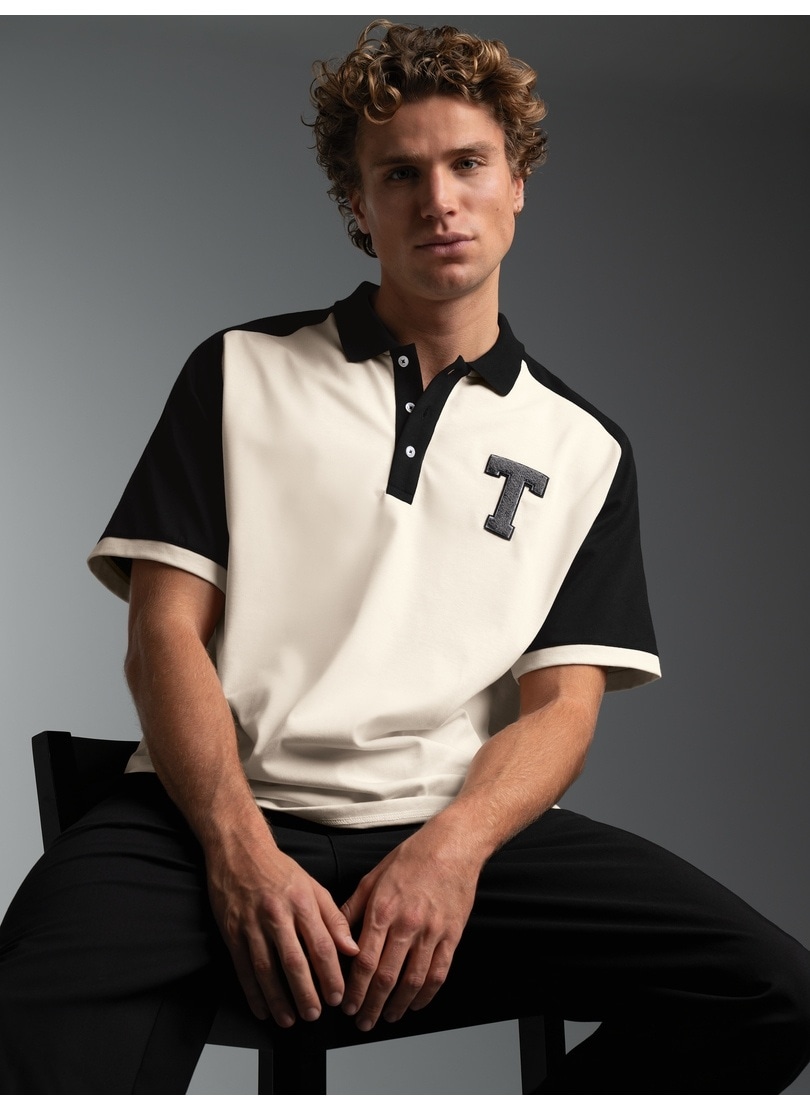 Trigema Poloshirt "TRIGEMA Poloshirt mit Raglanärmeln und trigema Brustpatch" 1