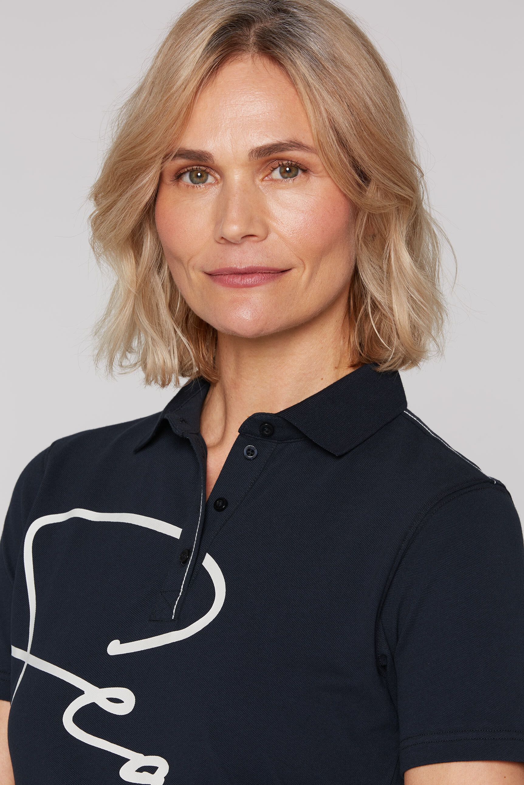 SOCCX Poloshirt, mit Seitenschlitze