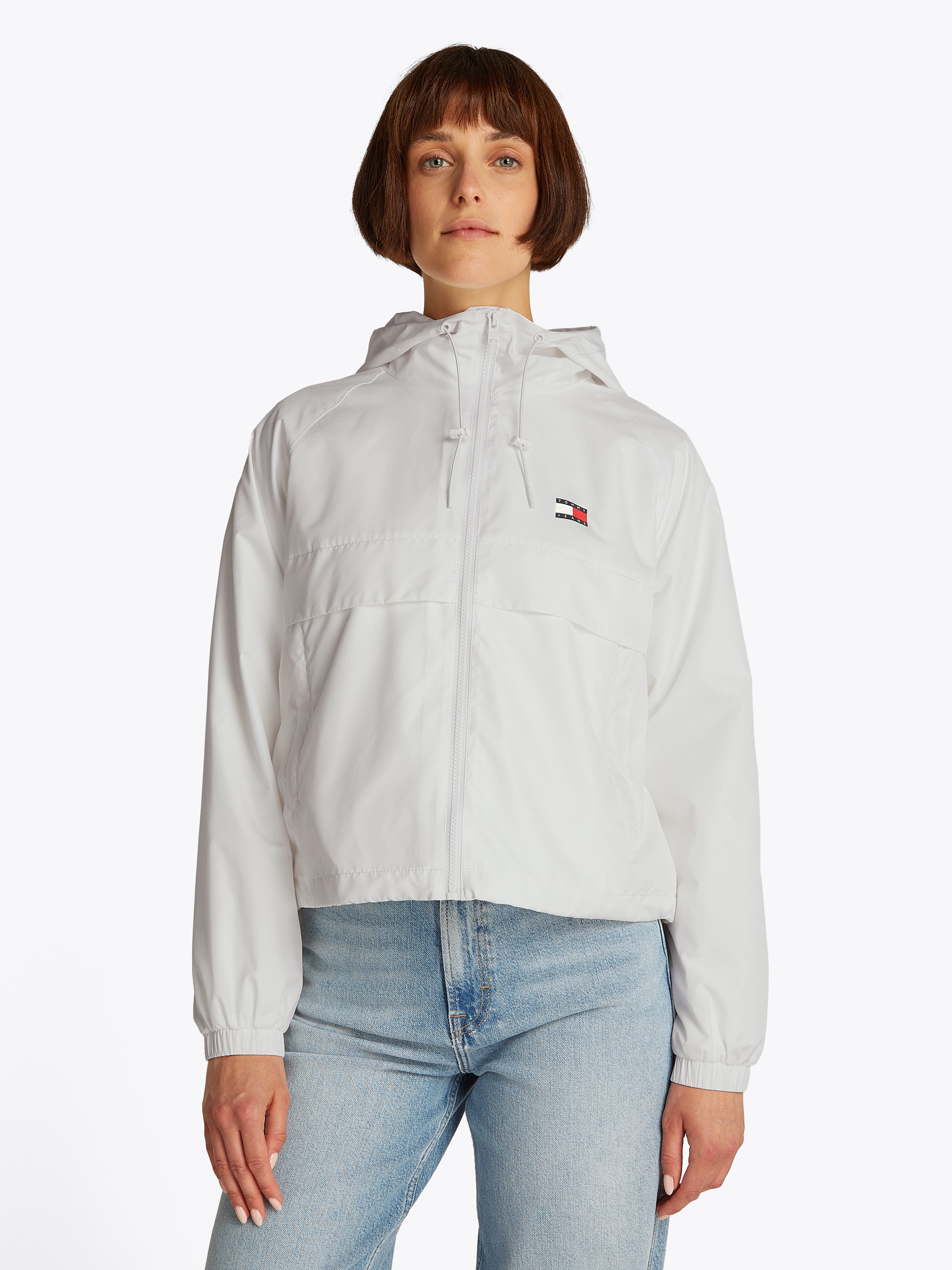 Tommy Jeans "TJW ESSENTIAL WINDBREAKER EXT" mit Kapuze mit Logodruck günstig online kaufen