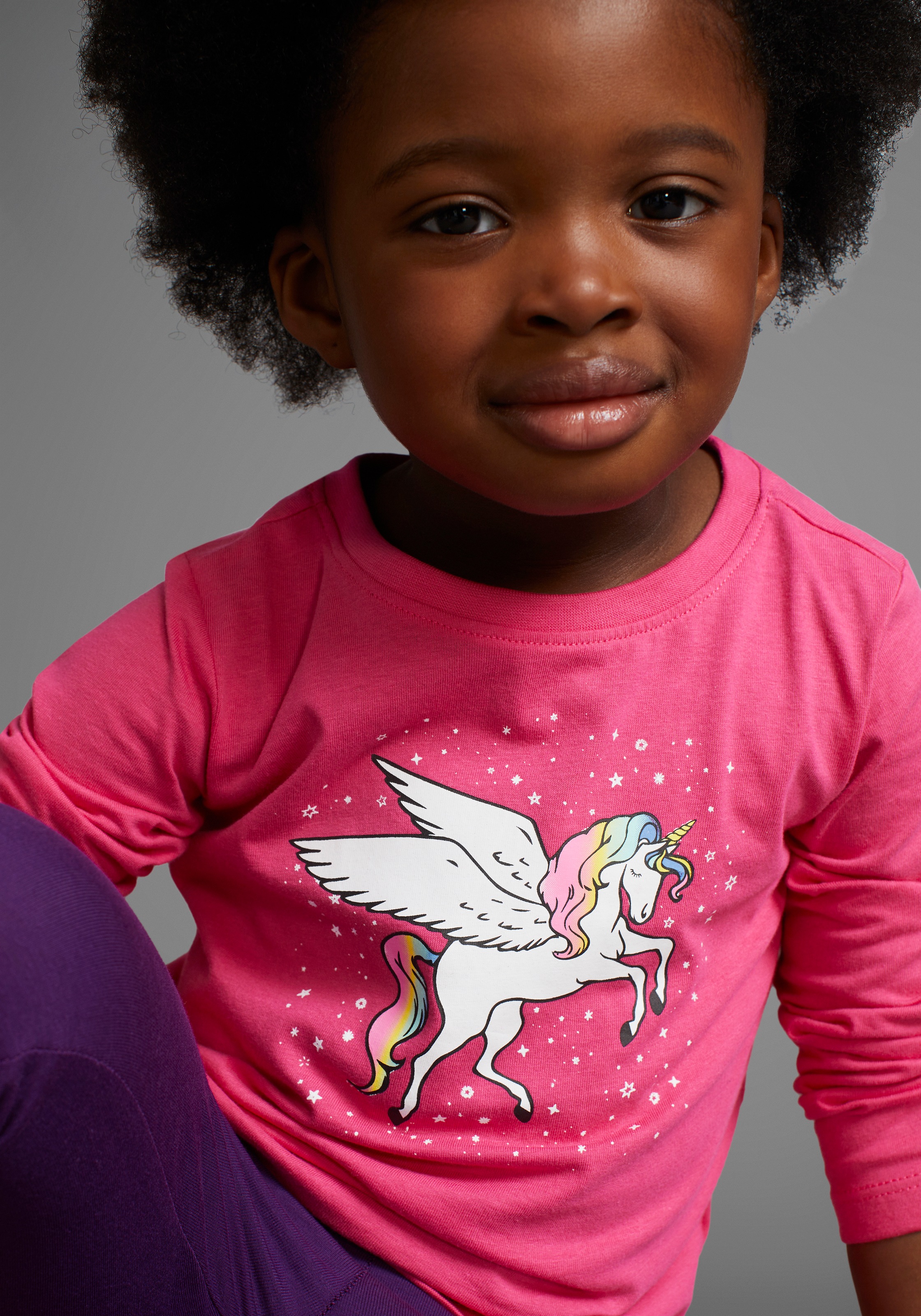 Thumbnail - KIDSWORLD Langarmshirt "mit süßem Einhorn Druck" langärmlig, hüftlange Passform, stylischer Druck