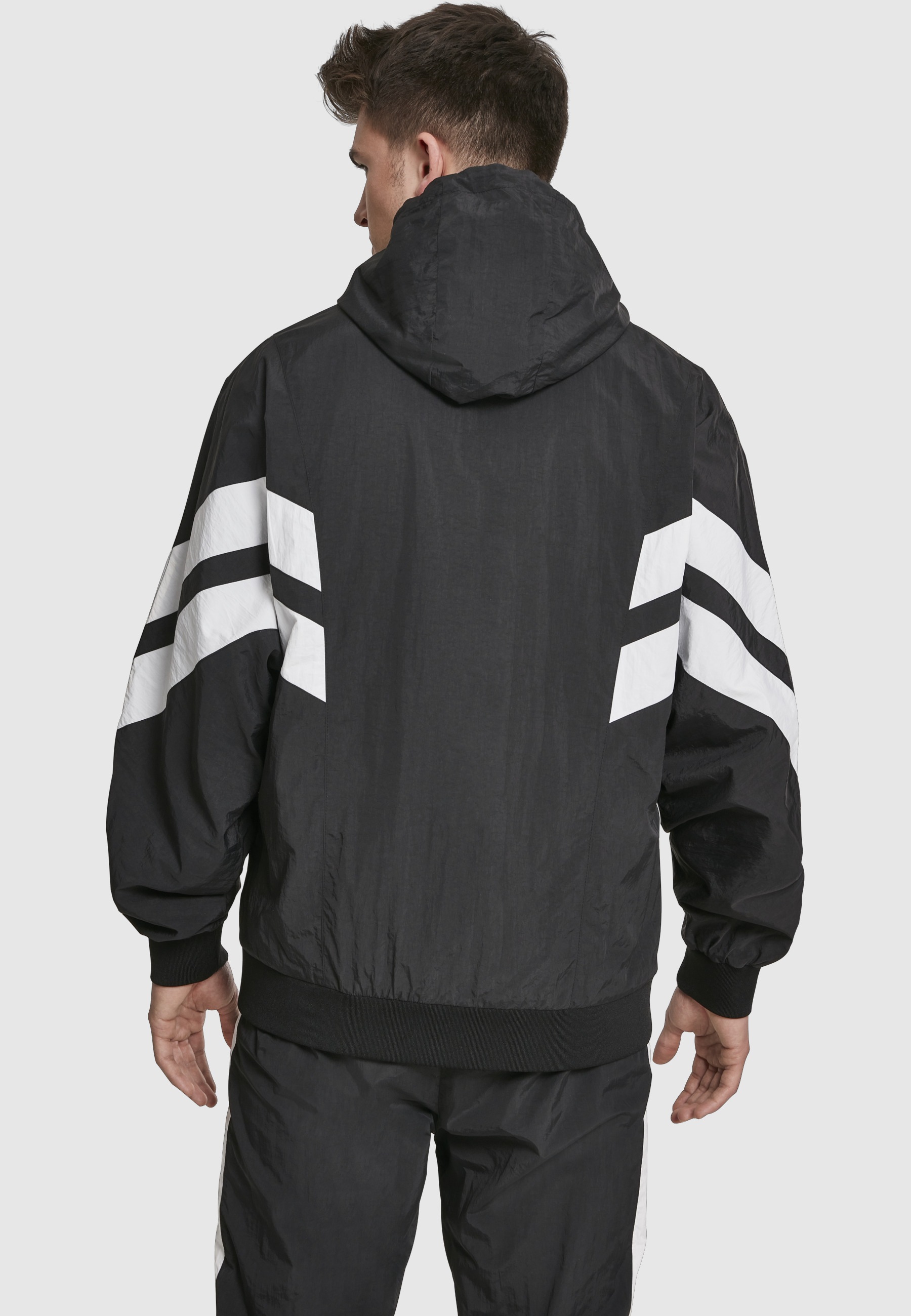 URBAN CLASSICS Allwetterjacke »Urban Classics Herren Crinkle Panel Track Jacket« 1 Stk. tlg. mit Kapuze