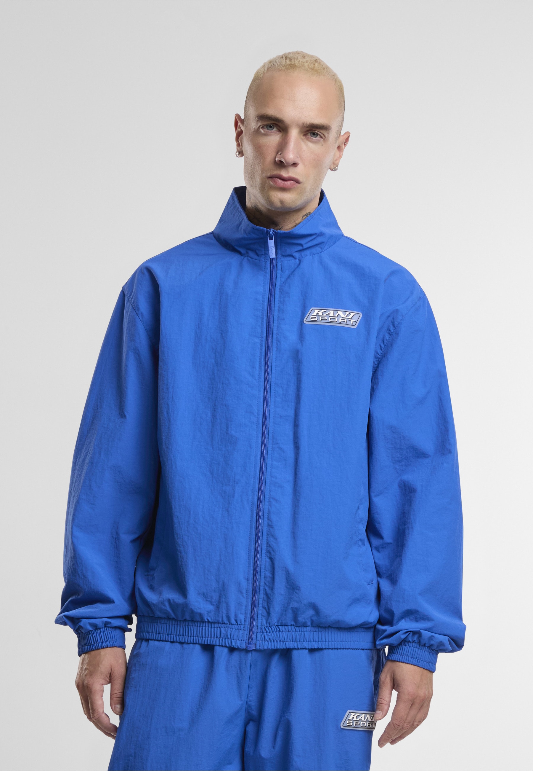 Karl Kani Trainingsjacke »Karl Kani Sport Patch Essential Trackjacket« 1 Stk. tlg. ohne Kapuze