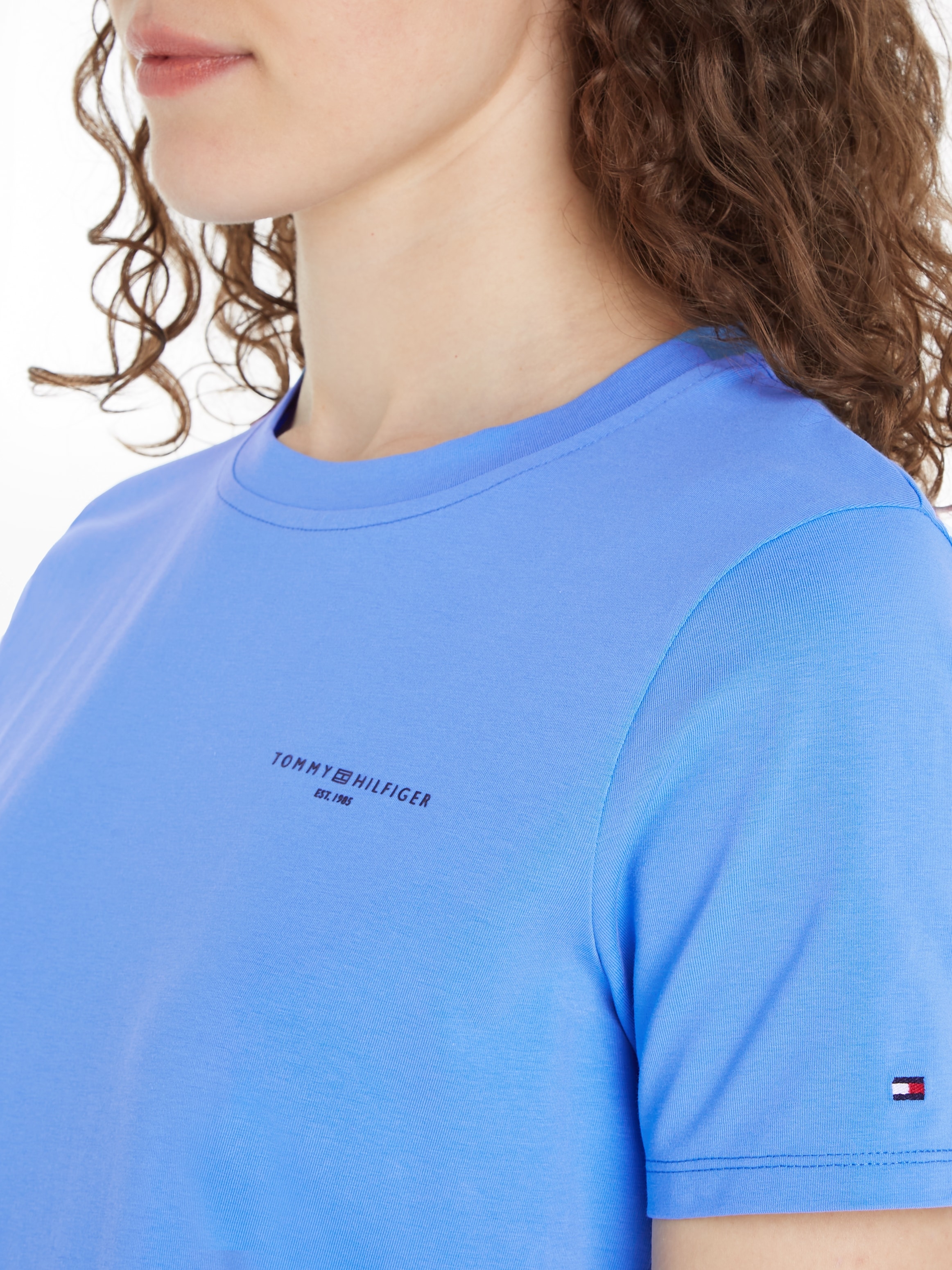 Tommy Hilfiger T-Shirt für »1985 bestellen Logoschriftzug CORP LOGO C-NK mit | REG SS«, MINI BAUR