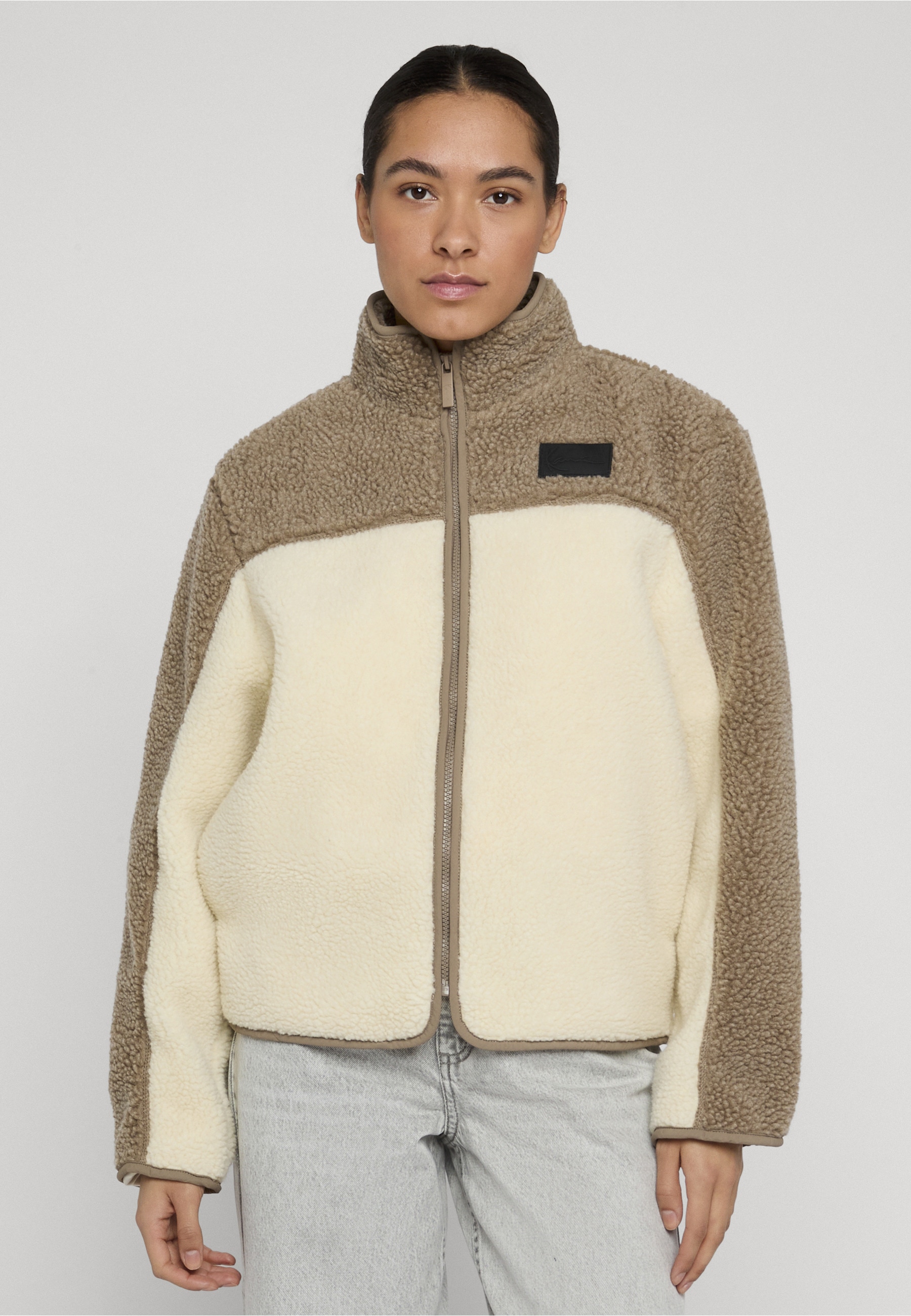 Karl Kani Trainingsjacke »Karl Kani Signature Teddy Trackjacket« 1 Stk. tlg. ohne Kapuze